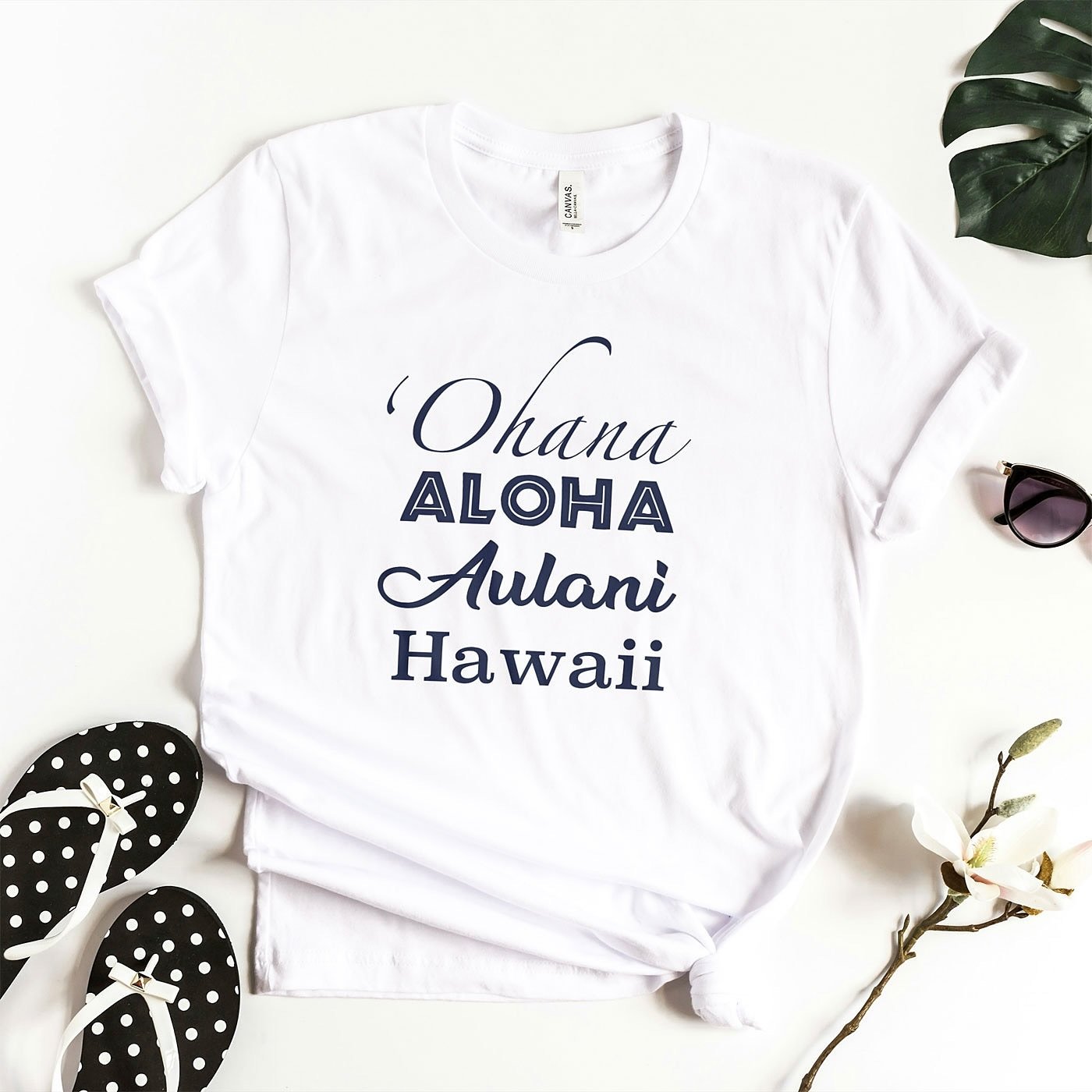 Ohana Aloha Aulani Hawaii. 

Inspired by the magic of Ohana, the Hawaiian Islands and that laid back Polynesian vibe, we created this South Pacific design for your &lsquo;Ohana and good karma. This unisex t-shirt is lightweight and comfy.

https://ww