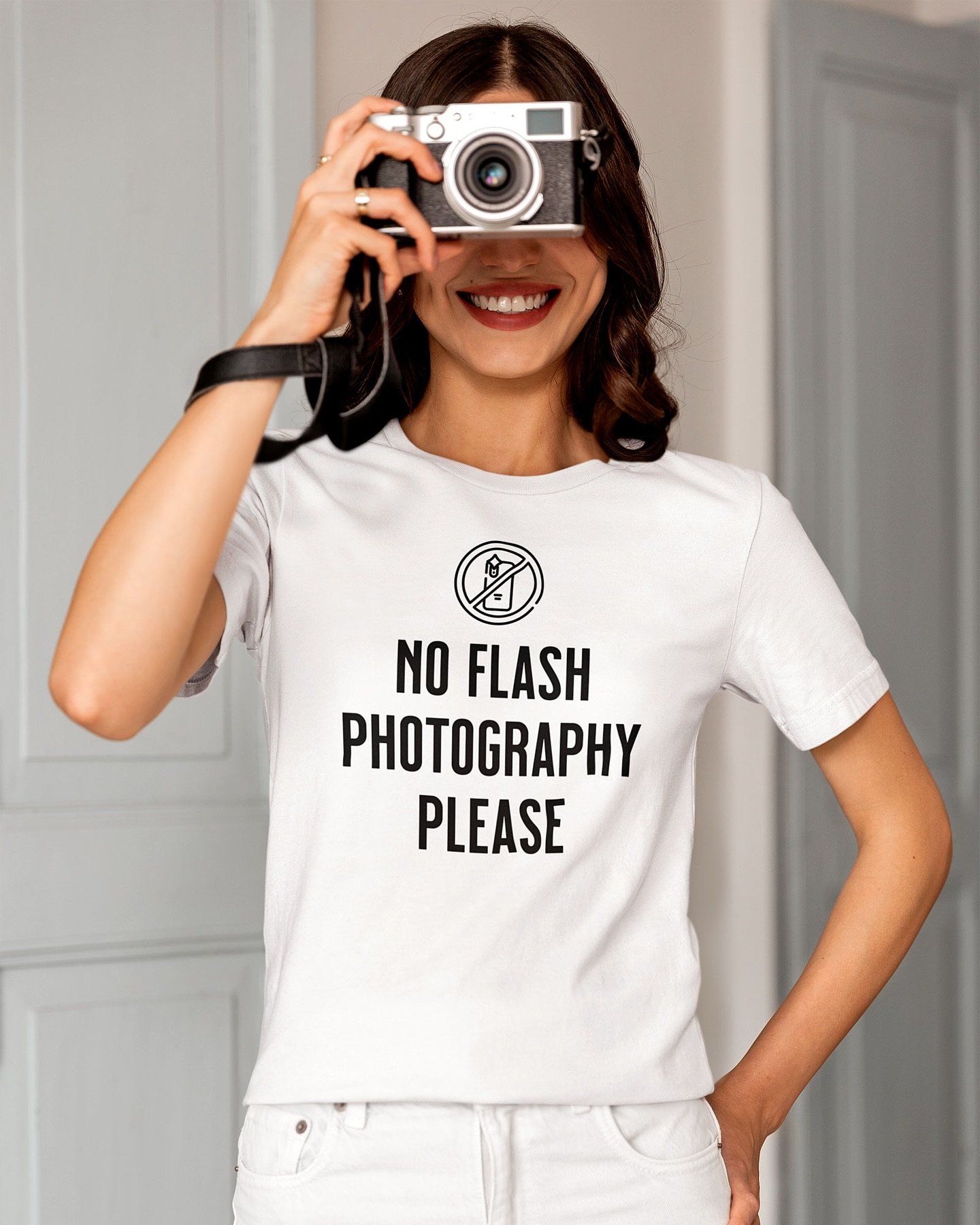 Step into the magic with our No Flash Photography Please t-shirt, inspired by the iconic message often heard in Disney Parks rides and attractions.

White Shirt
https://www.1923mainstreet.com/shop/p/no-flash-photography-t-shirt

Black Shirt
https://w