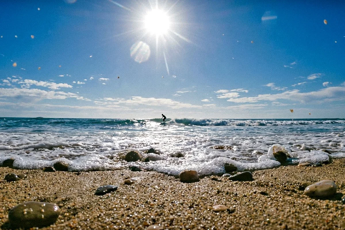 Low angle beach photo, surfing.