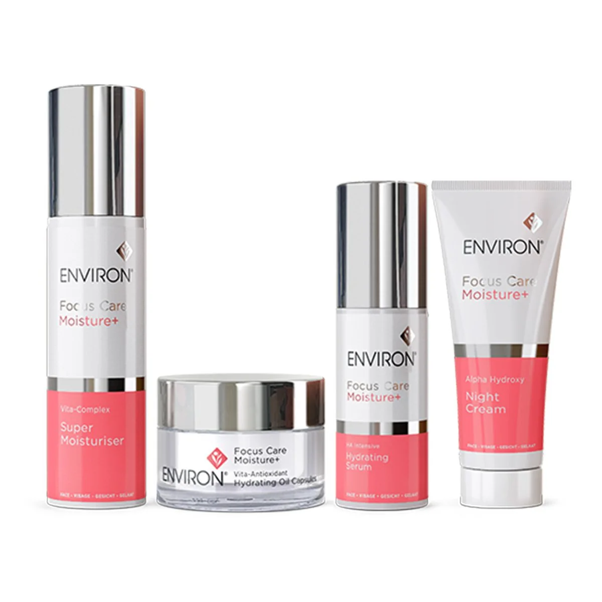 Set of four skincare products from Environ's Focus Care Moisture+ line, including a super moisturizer, hydrating oil capsules, a hydrating serum, and a night cream, all with packaging featuring white, pink, and silver accents.