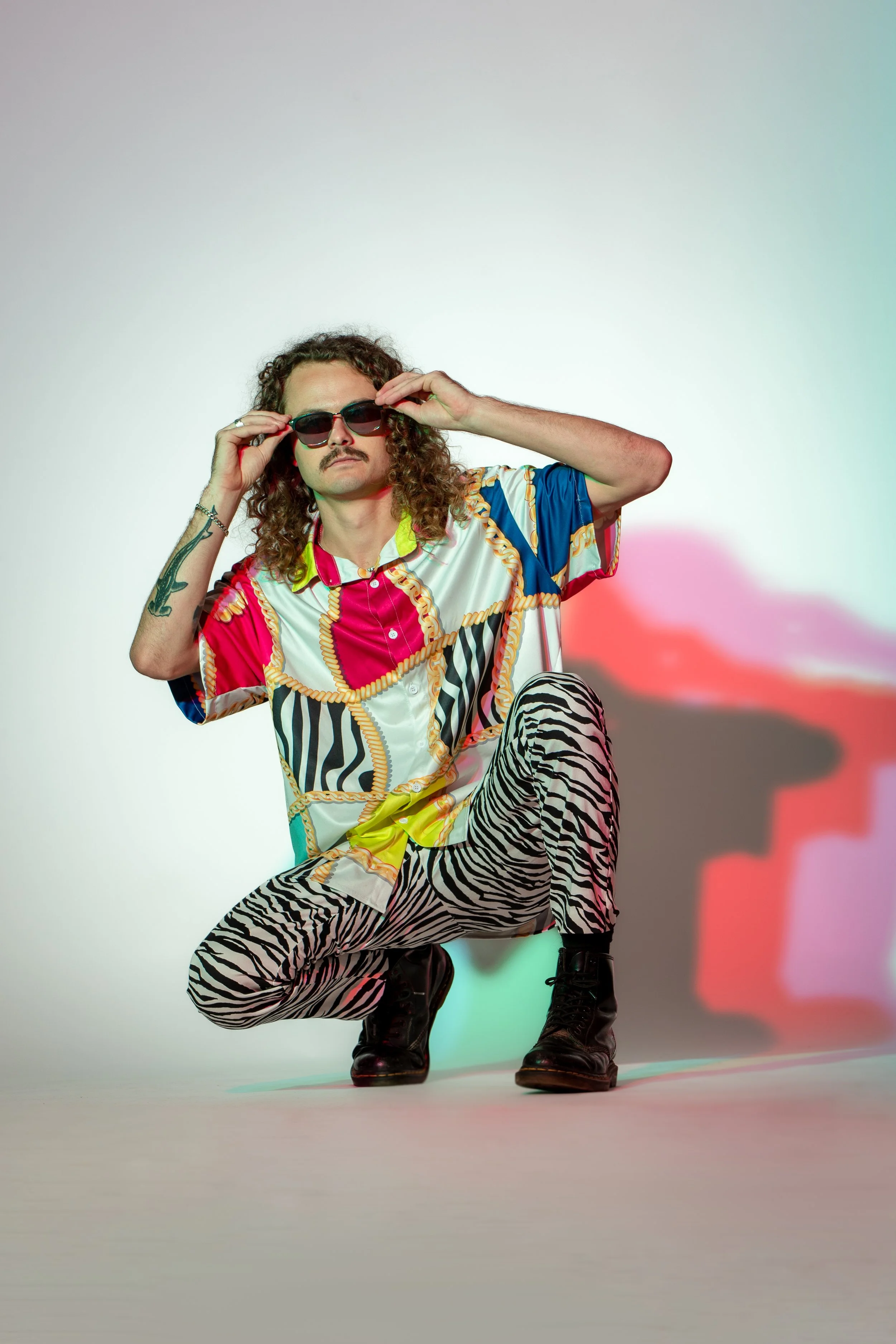 Bass music DJ Ashez poses in preparation for a 404 Productions live event performance.