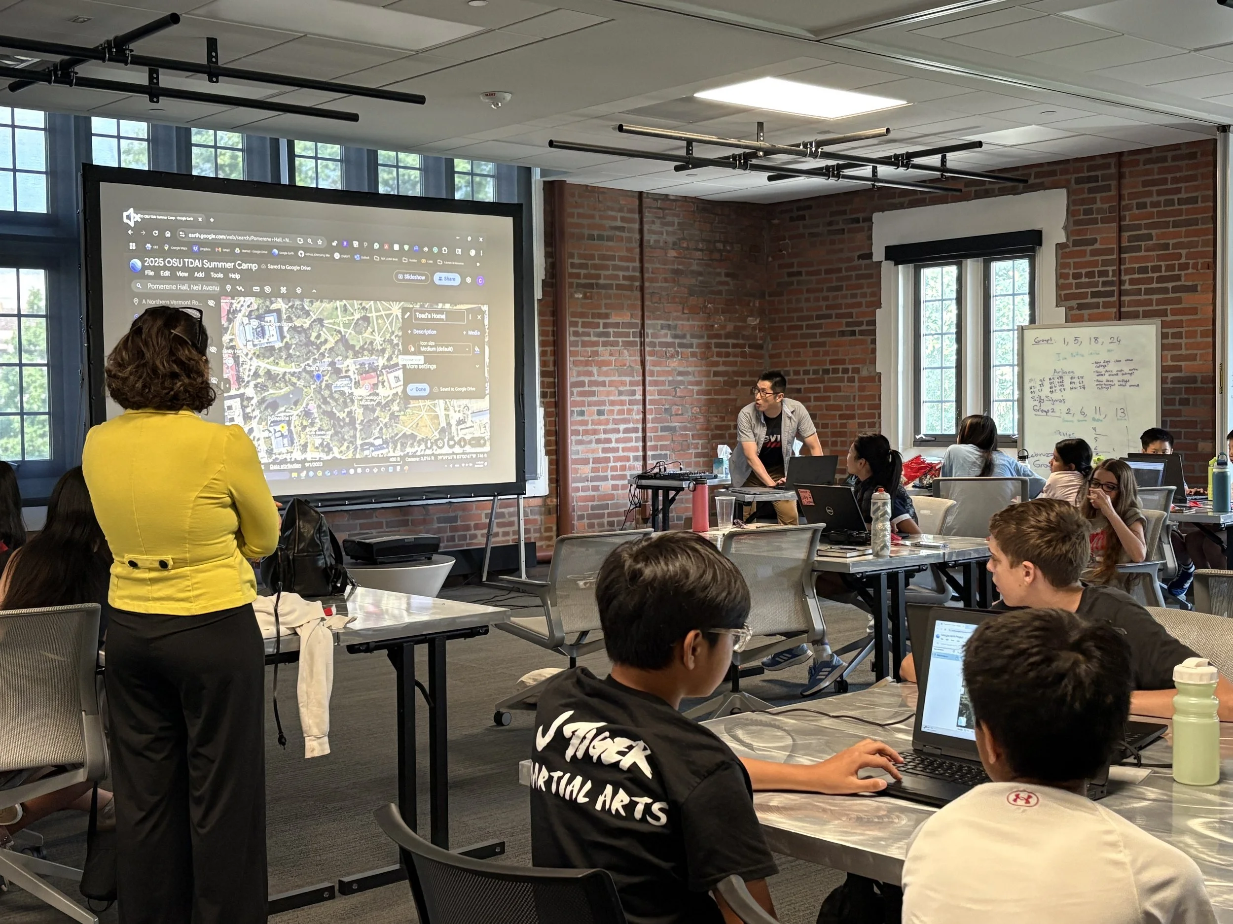 Chenyang and Hikaru teach middle-schoolers during the TDAI's Data Science Summer Camp