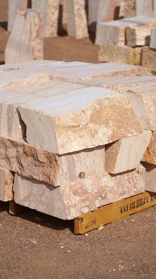 Slabs of tan stone used for stone Cantera fountains sit at the materials center at the Garden Center of Las Cruces, New Mexico. 