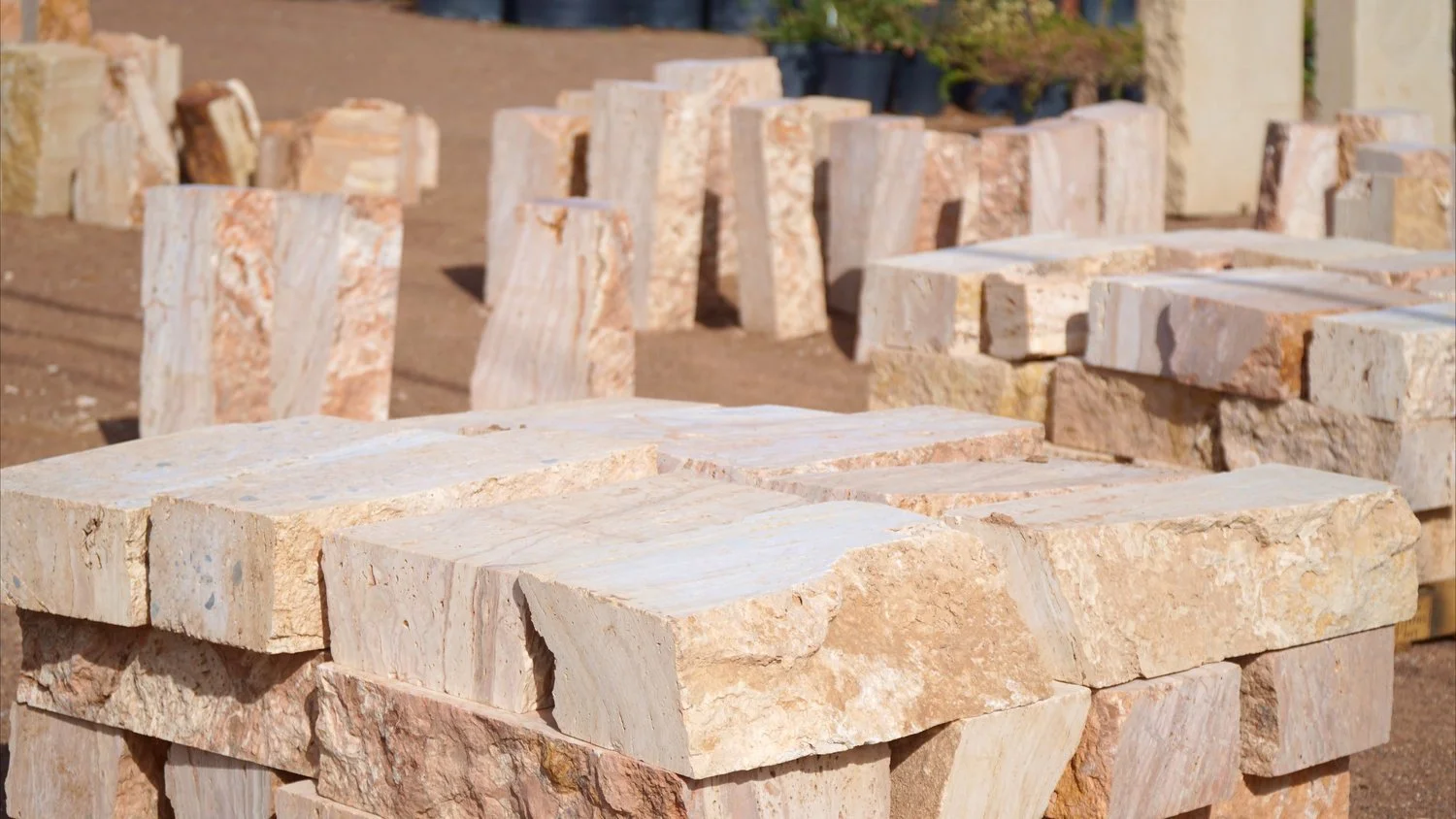 Slabs of tan stone used for stone Cantera fountains sit at the materials center at Garden Center Las Cruces. 