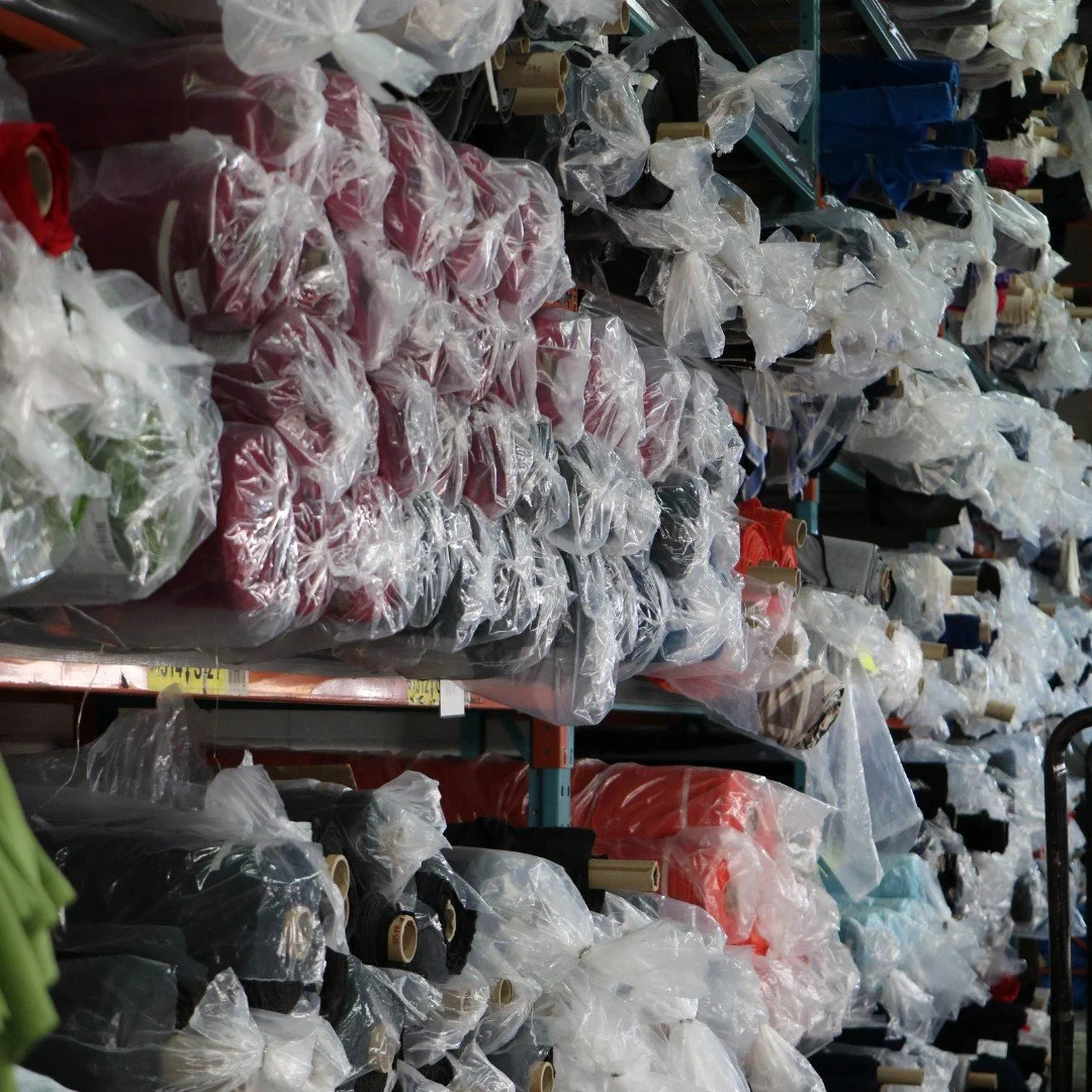 These shelves are always full of the most vibrant and beautiful fabrics. Did you know we offer fabric storage? Not only does it save you space, but it also makes the production process more efficient since the fabric is already here, waiting to go!

