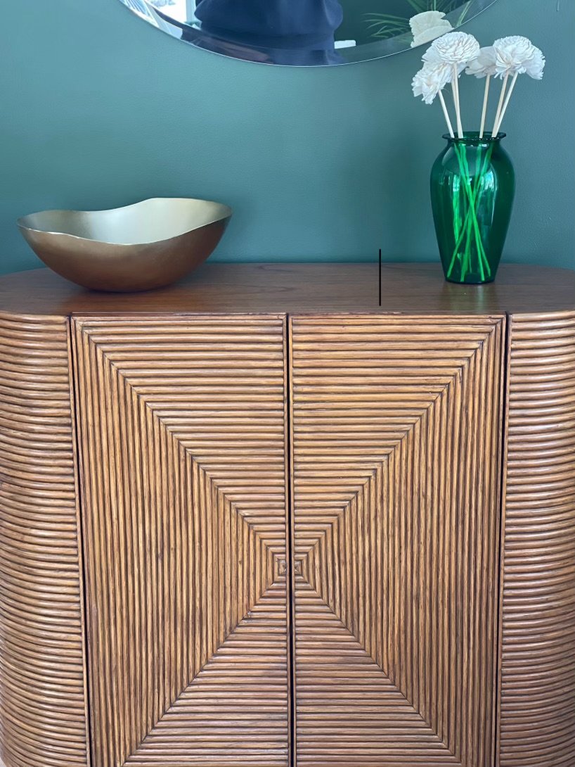 Gunstock Road After - We love details and finding this beautiful bar cabinet helped provide the perfect landing spot for this vintage vase and a new piece purchased for the renovation.