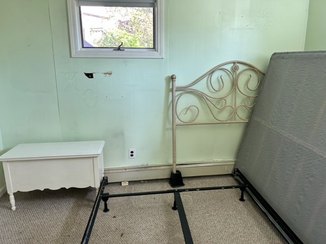 Bedroom After: Furniture awaiting pick-up by local charity