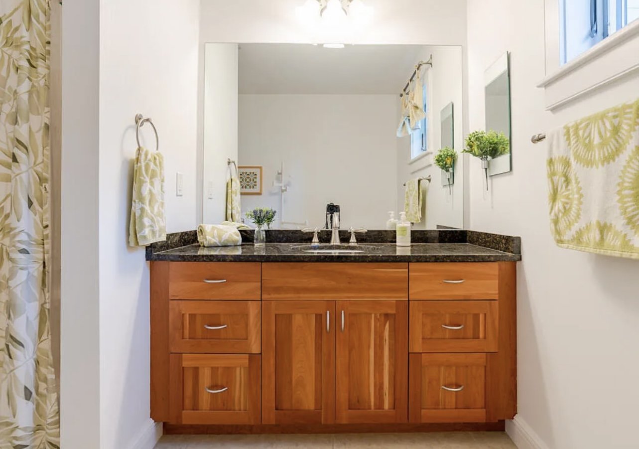 Guest Bathroom Before: Dated vanity and fixtures.