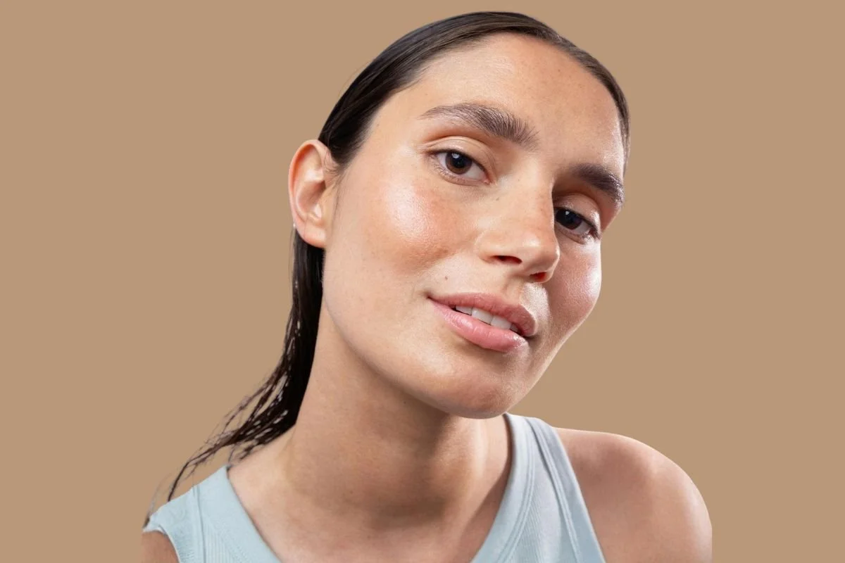 Fresh-faced woman with naturally hydrated skin and a soft, healthy glow.