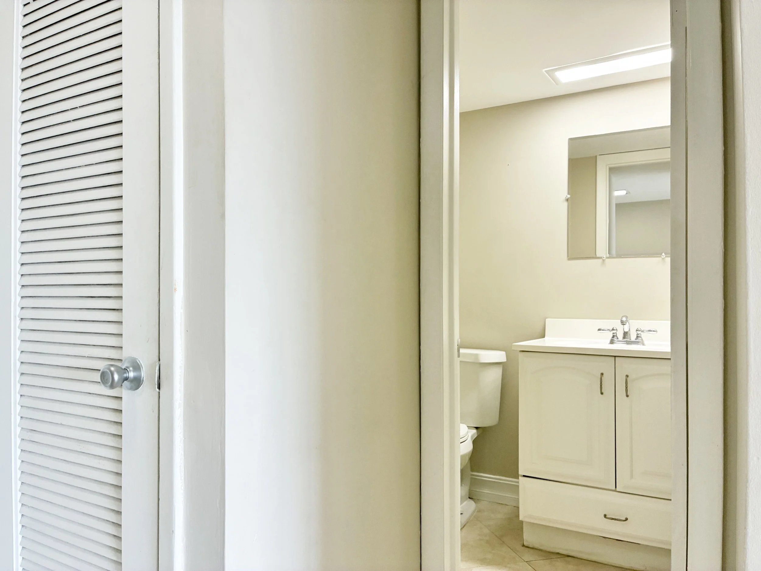 17-Linens Closet and Guest Half Bath.jpg