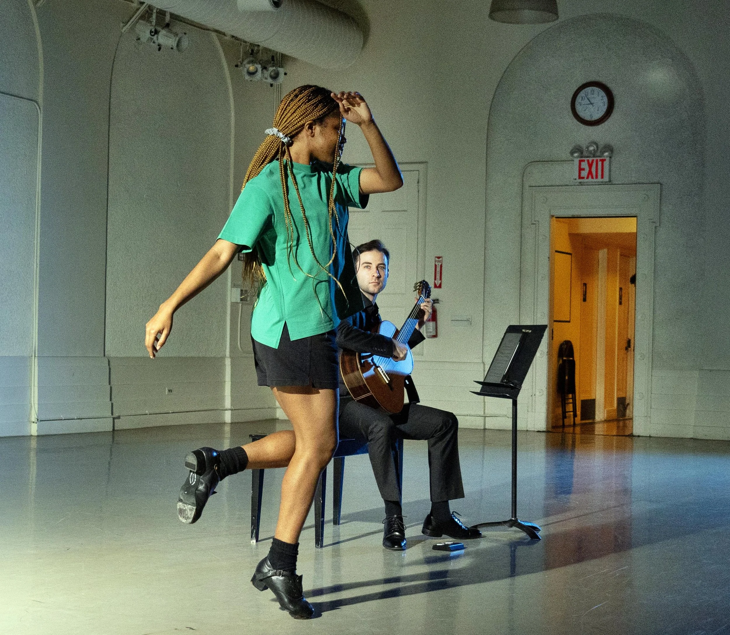 Step dancer Kaitlyn Sardin (Kaitrock) and classical guitarist Miles Johnston in "A Pop-Up Ballet at New York City Center," 
