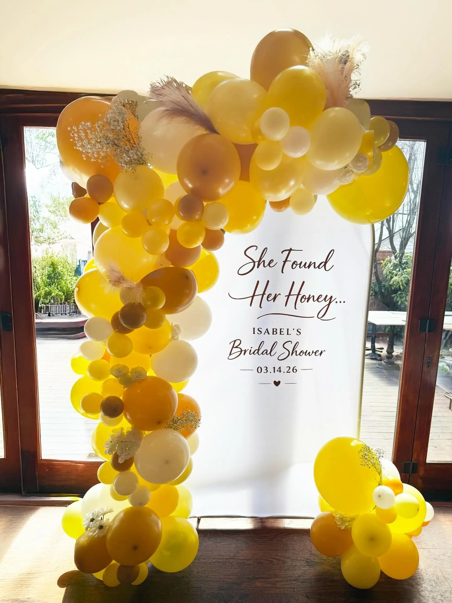 She found her honey. 🍯 💛
Soft yellow hues, delicate florals, and a touch of sweetness made this bridal shower setup feel extra special. Our custom garland and panel created the perfect backdrop to celebrate the bride and the love she found.

📍 Boo