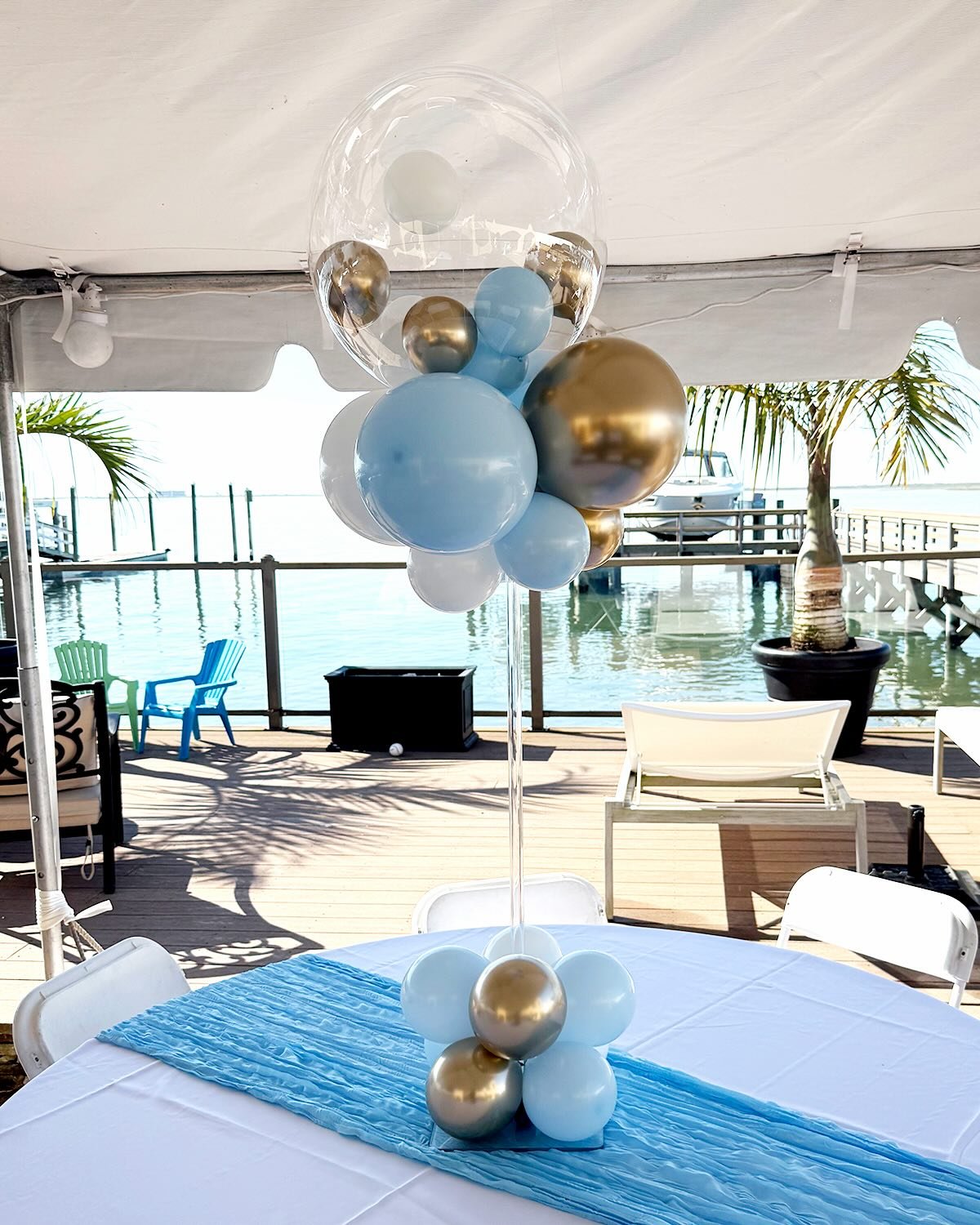 A little pop of elegance for every table.

These custom centerpieces brought the perfect touch to this waterfront celebration with soft blue, white, and gold tones paired with our signature bubble balloon design. Simple, elevated, and made to stand o