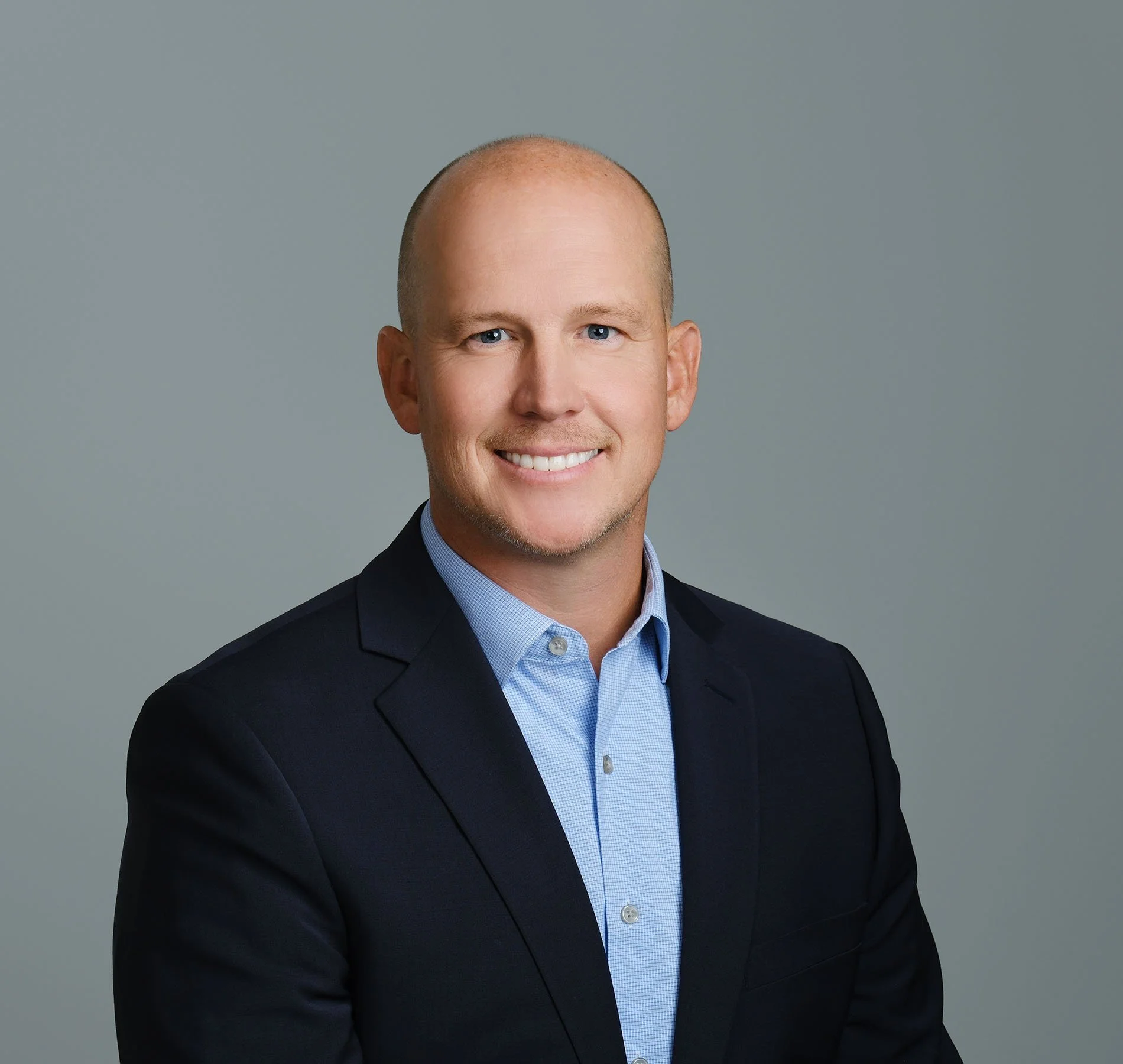 Professional headshot of Scott Kellett in suit for fractional CFO services and chief financial officer leadership at North Peak Services