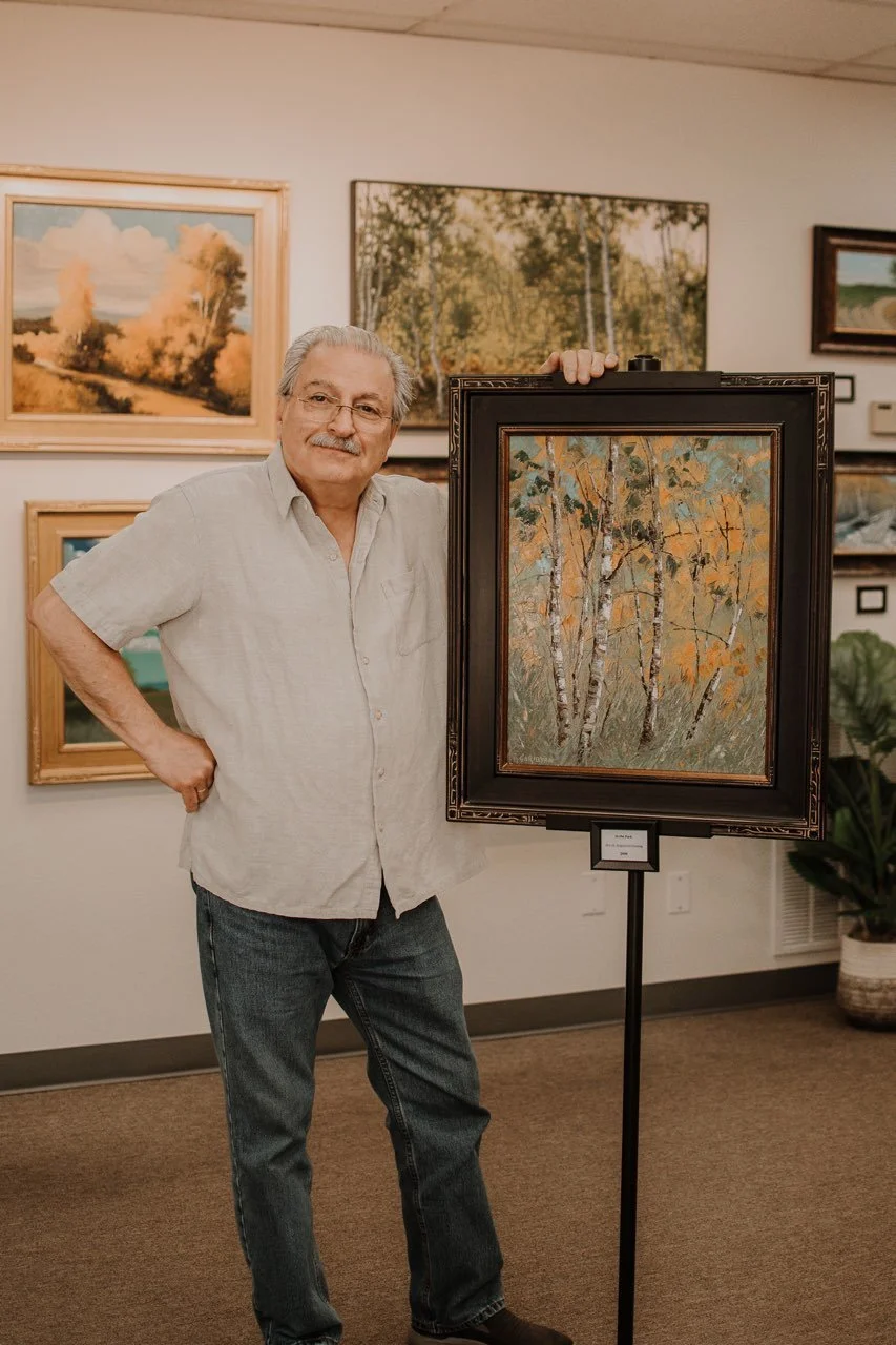 artist standing in gallery