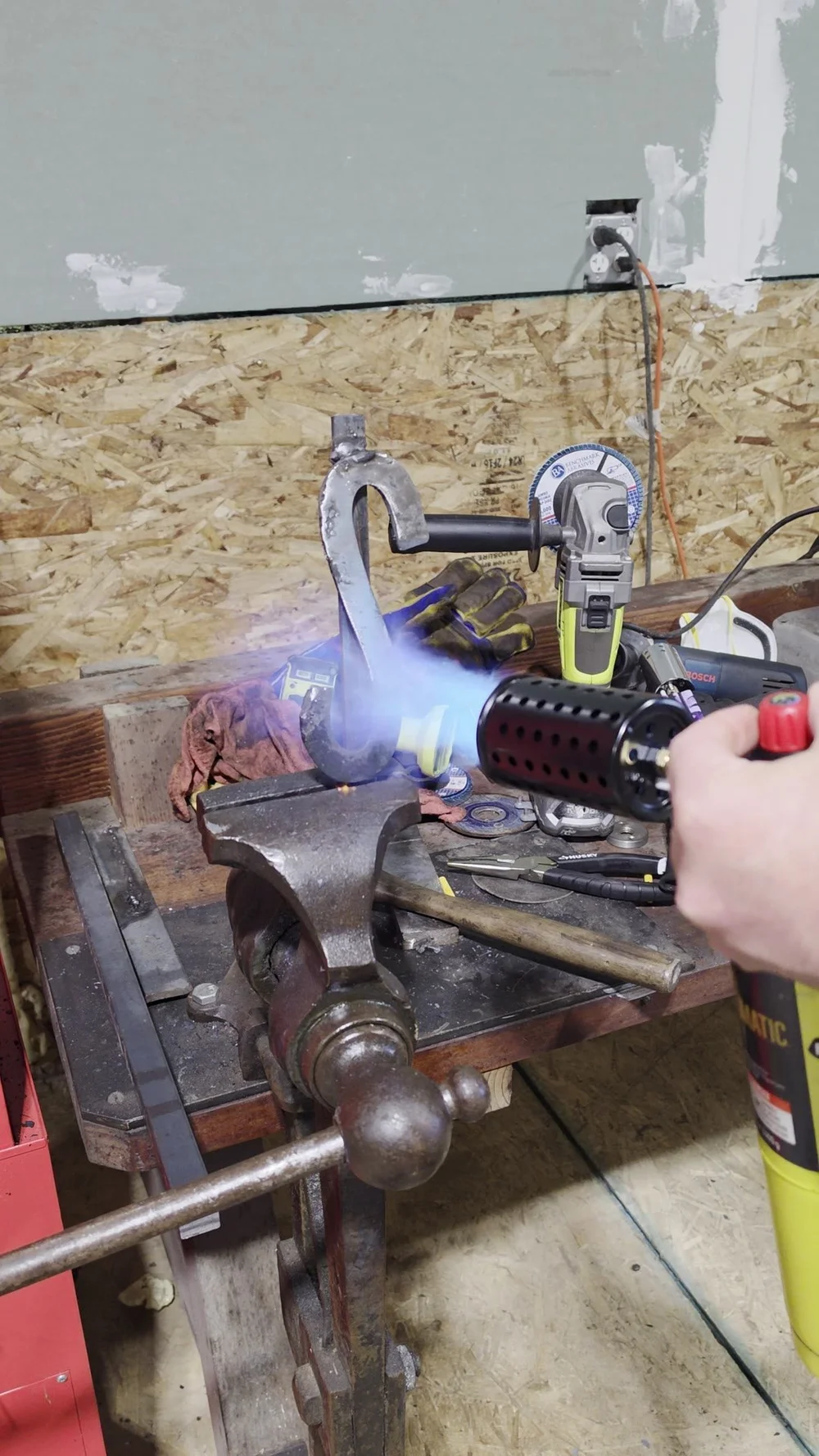 Torch flame on a piece in the vise