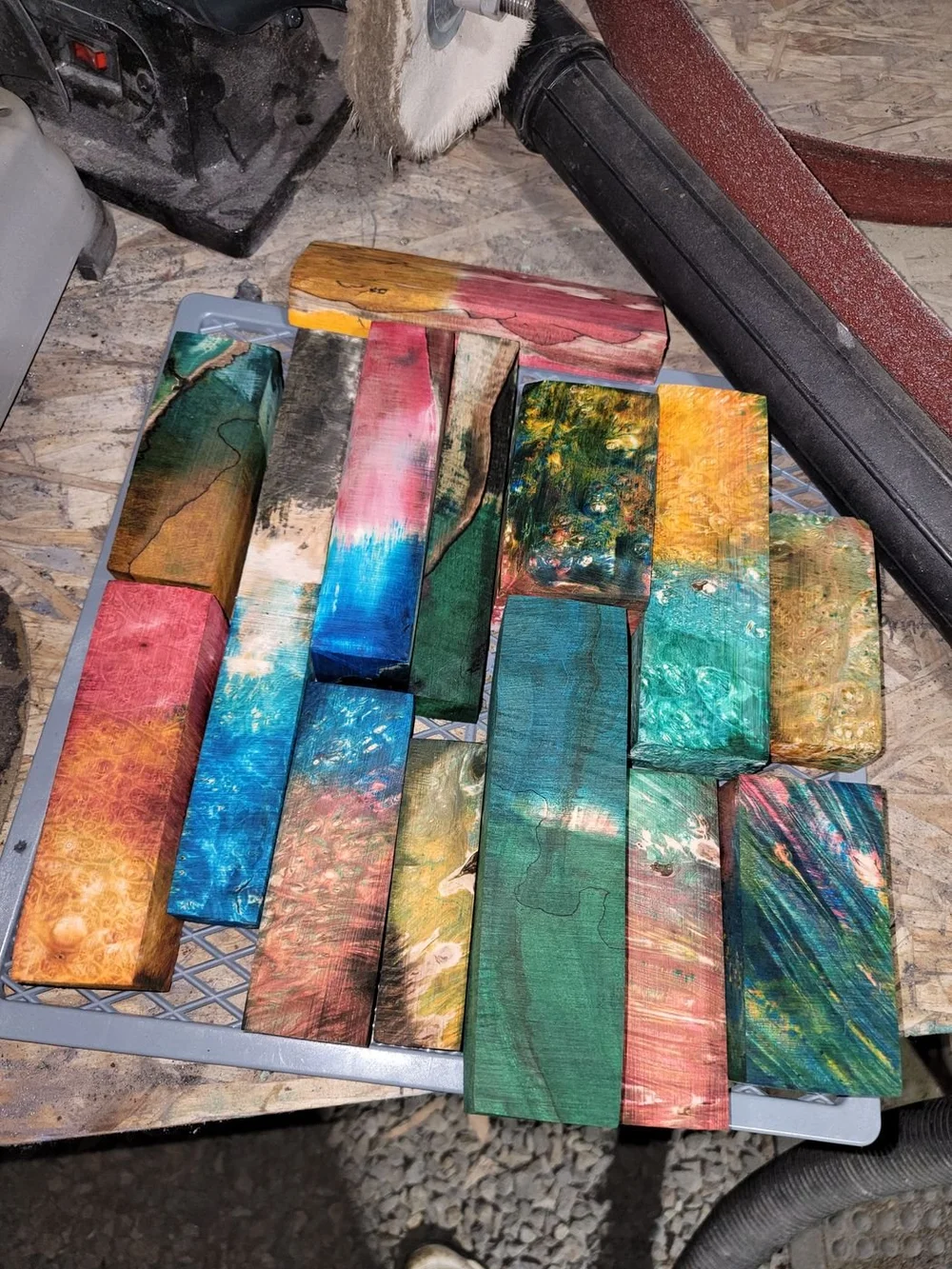 A table full of dyed, stabilized handle blocks