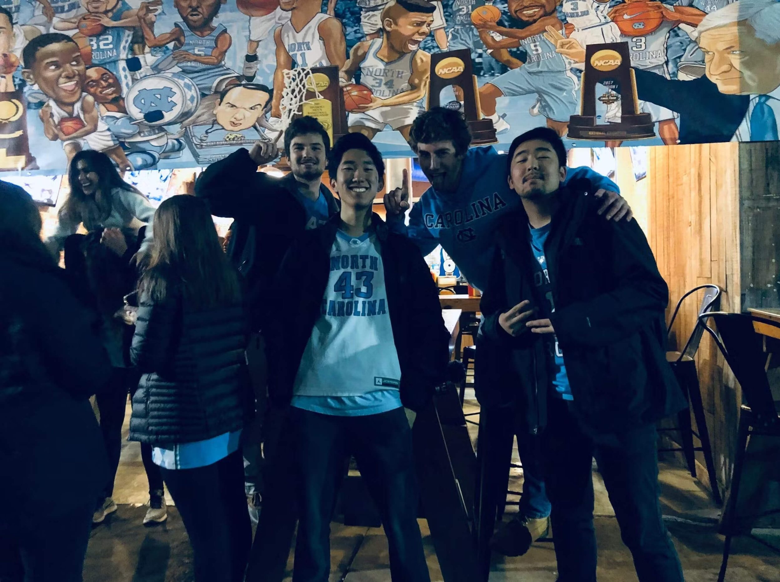 Caleb with some of his college friends taking a picture together at UNC Chapel Hill