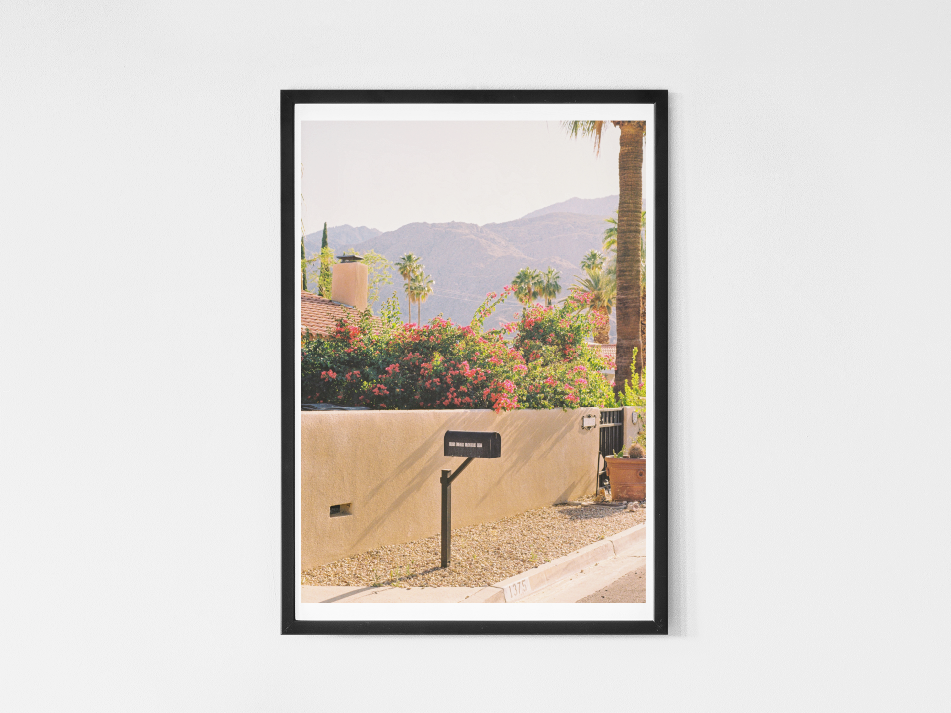 mockup-of-a-vertical-art-print-hanging-on-a-solid-wall-35889-r-el2 copy.png