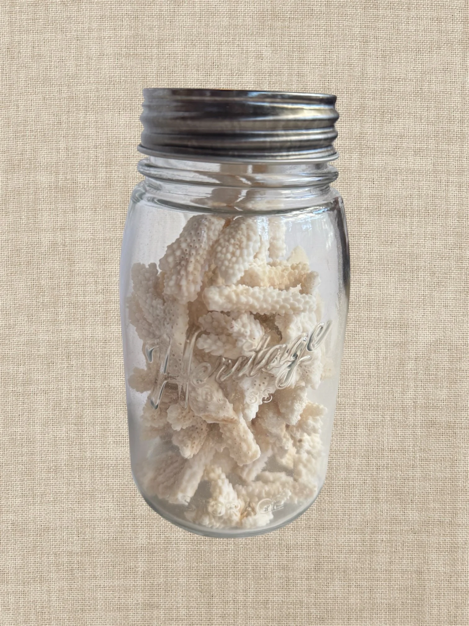 vintage jar of coral pieces