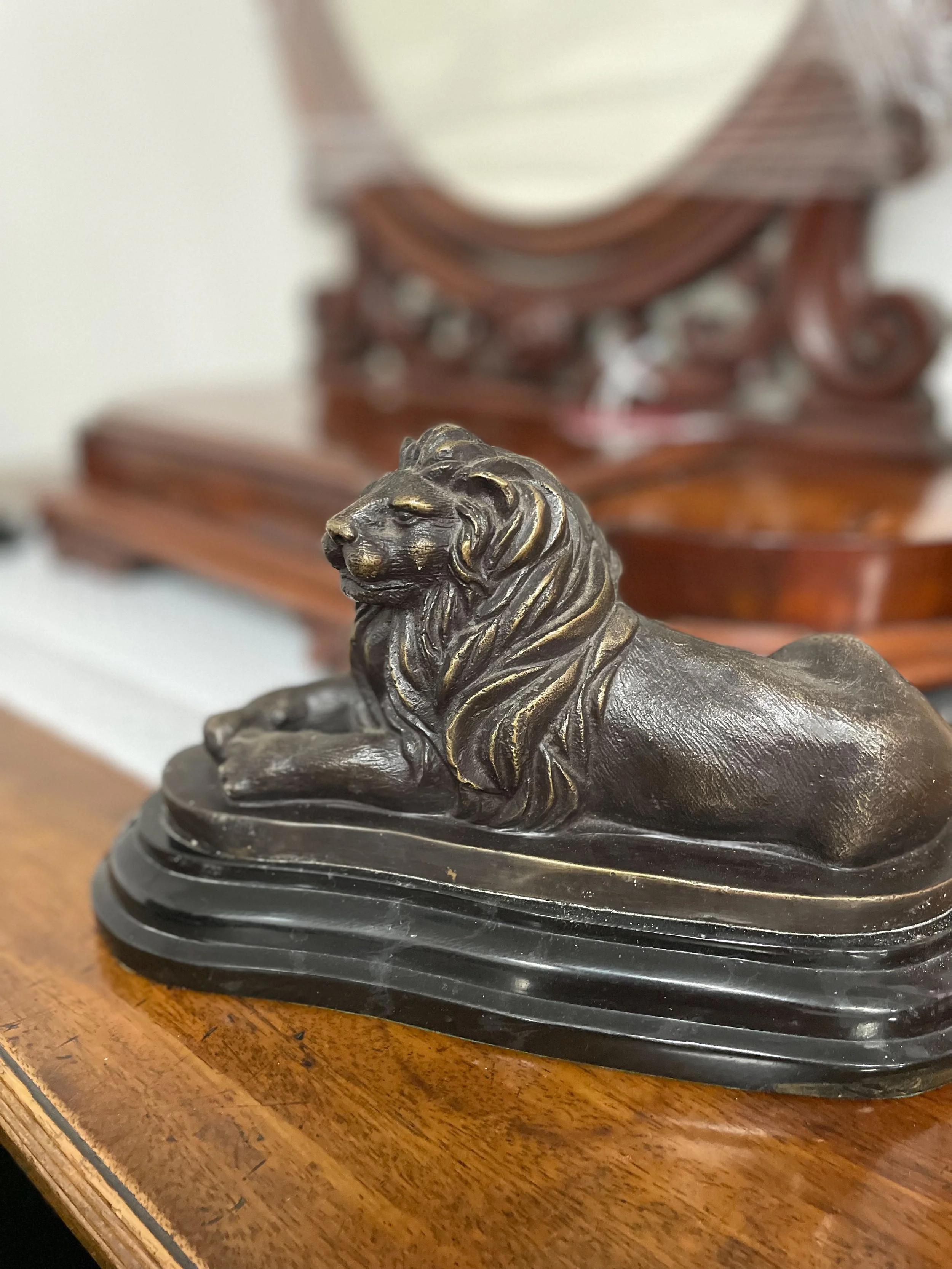 BRONZE LION ON BLACK MARBLE BASE