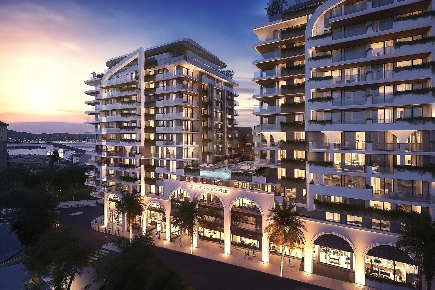 Queen’s Gate Waters residences and landscaped entrance at dusk