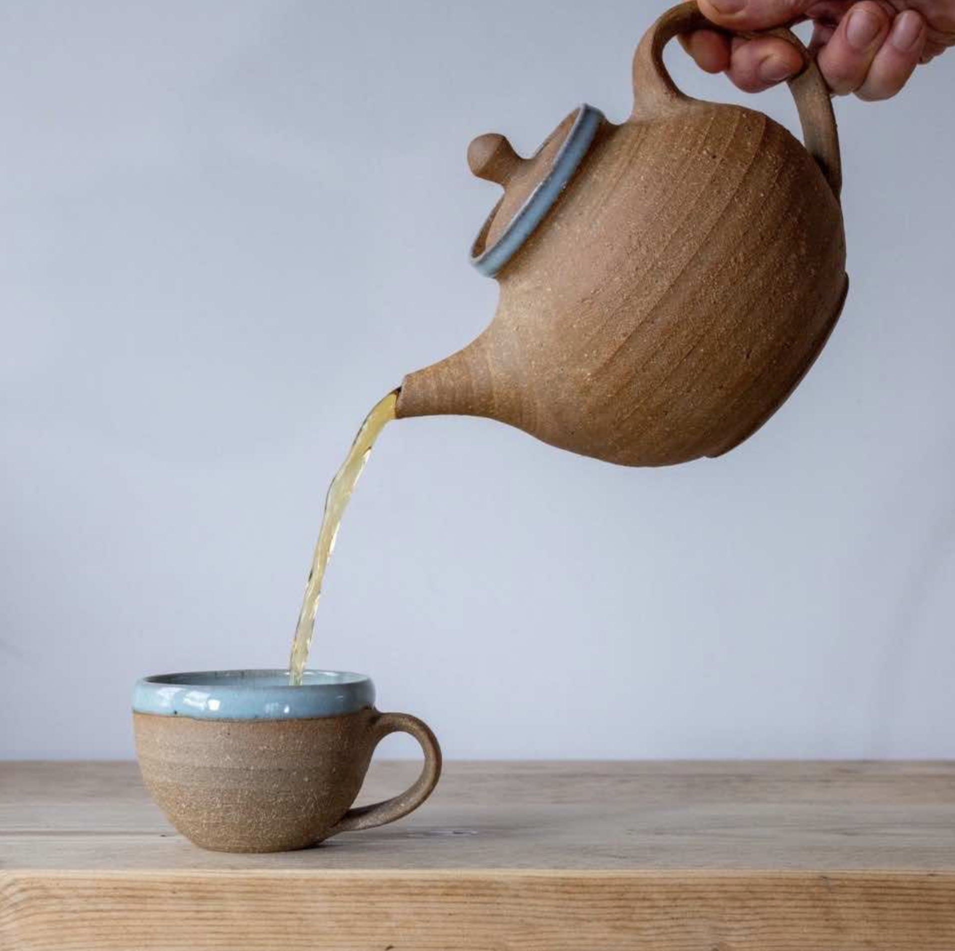 Matt Waite teapot pouring tea in mug.png