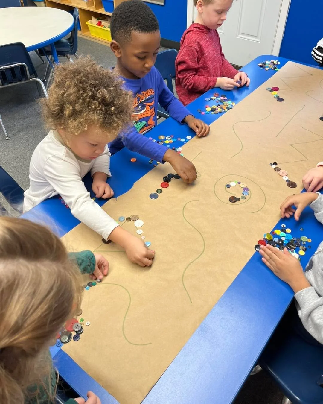 Buttons, buttons, buttons&hellip;a fine motor activity which encourages cognitive planning! Try it at home with Cheerios!