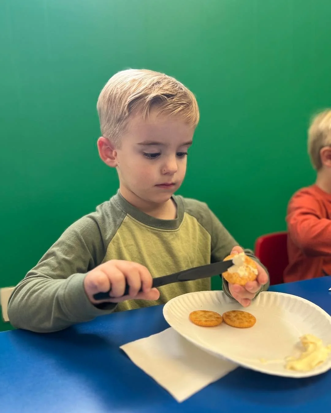 It was Teddy Bear Picnic day! Students helped prepare the picnic by learning the practical skill of using a knife to spread butter.