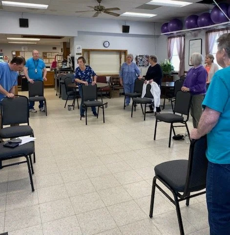  Physical therapist explaining a personalized home exercise program 