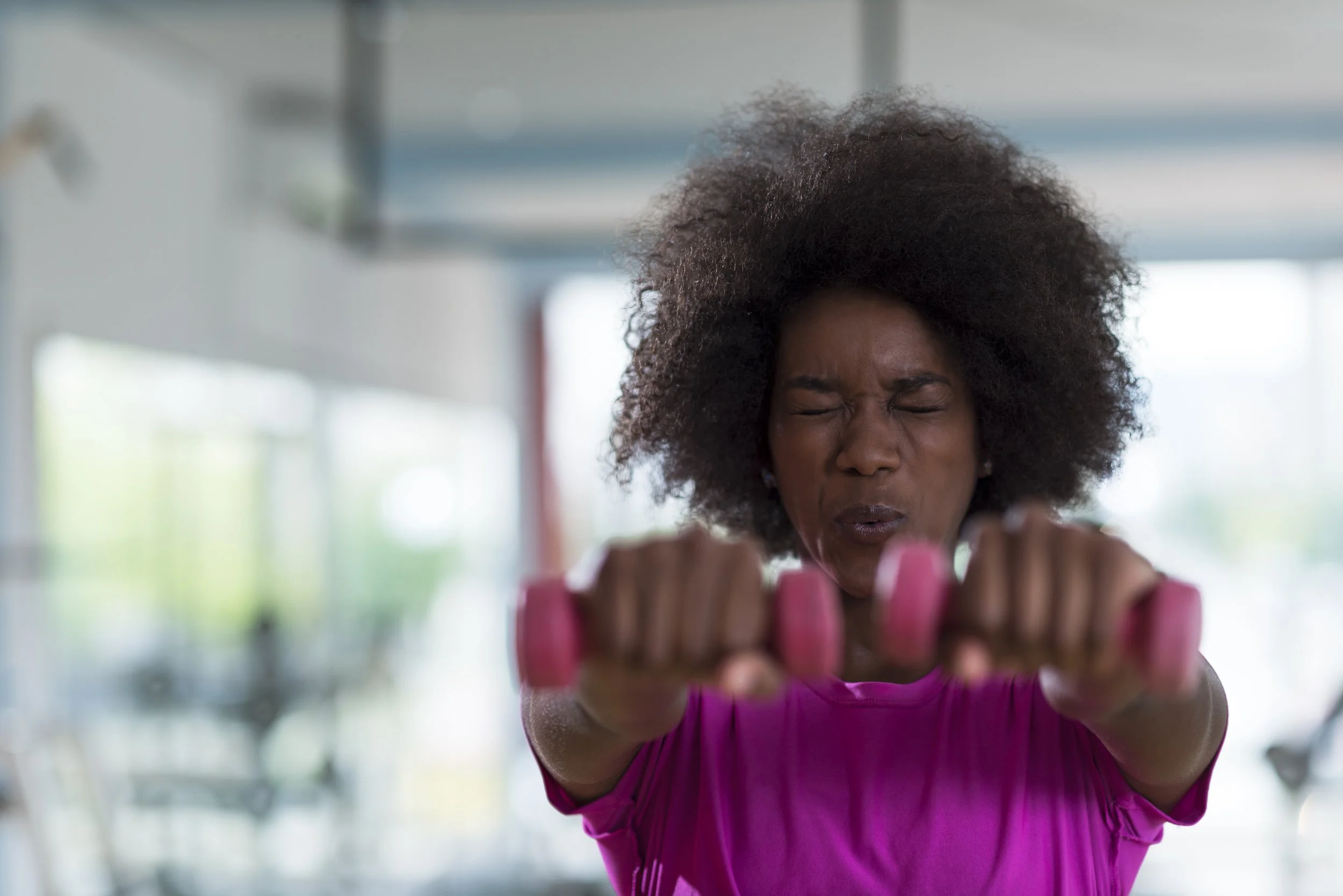A woman lifting weights.