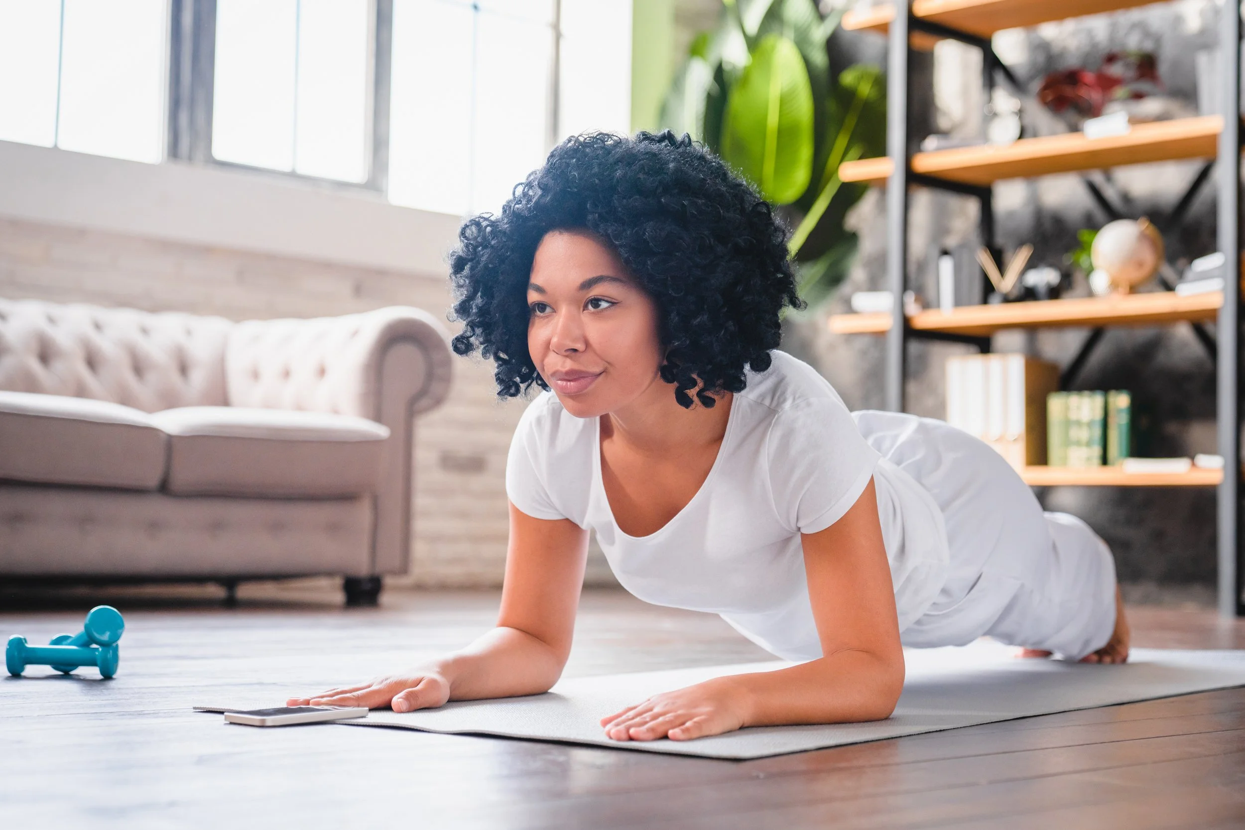 A woman doing a plank at home