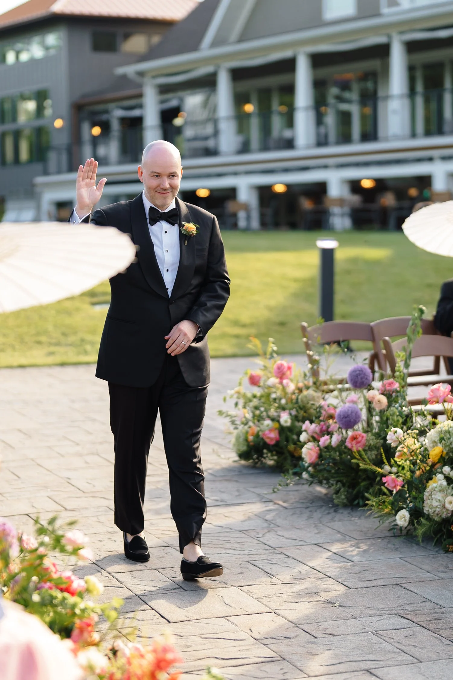 groom, walking, aisl, pond ceremony, florals, summer.jpg