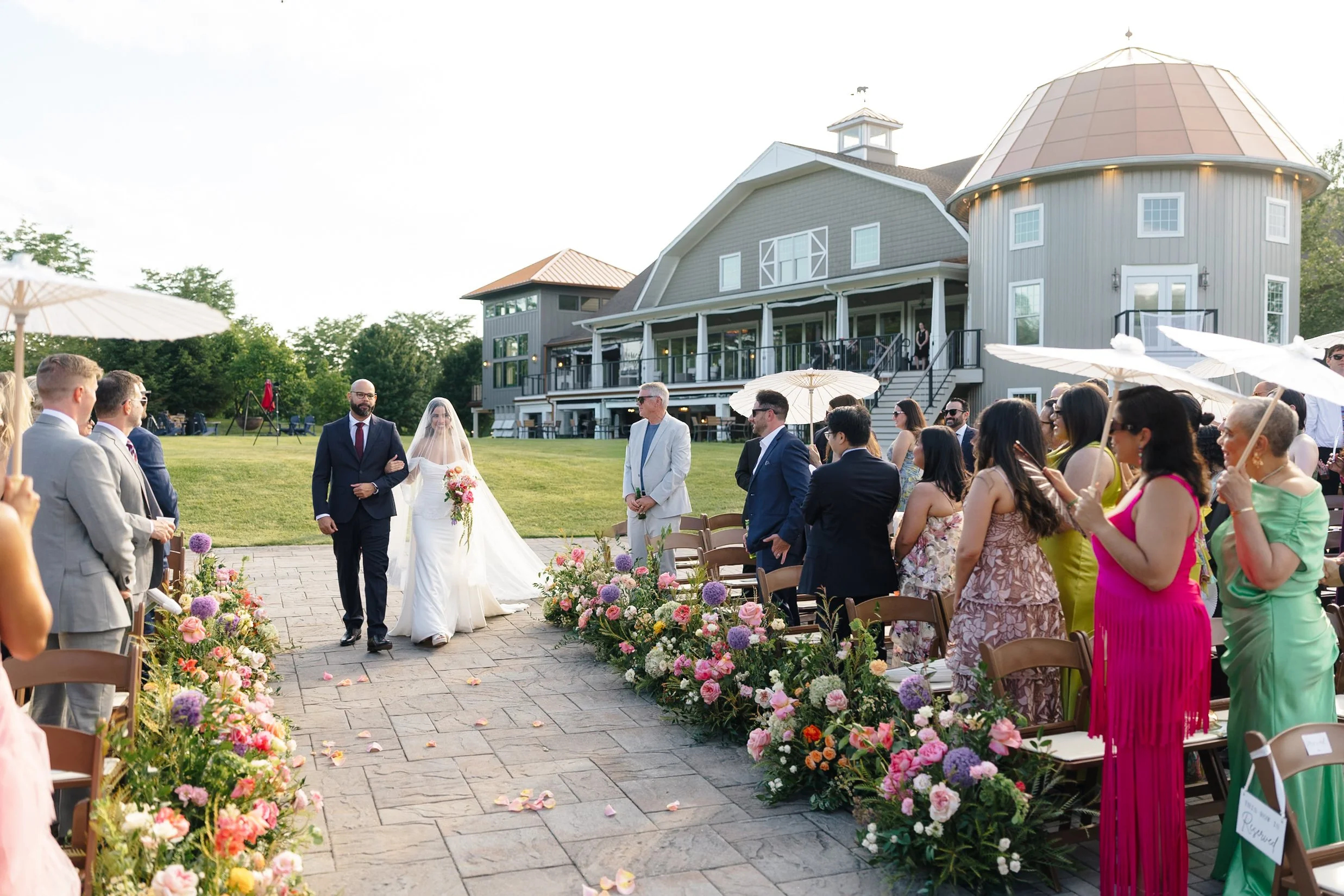 venue, walking down aisle, florals, summer, umbrellas.jpg