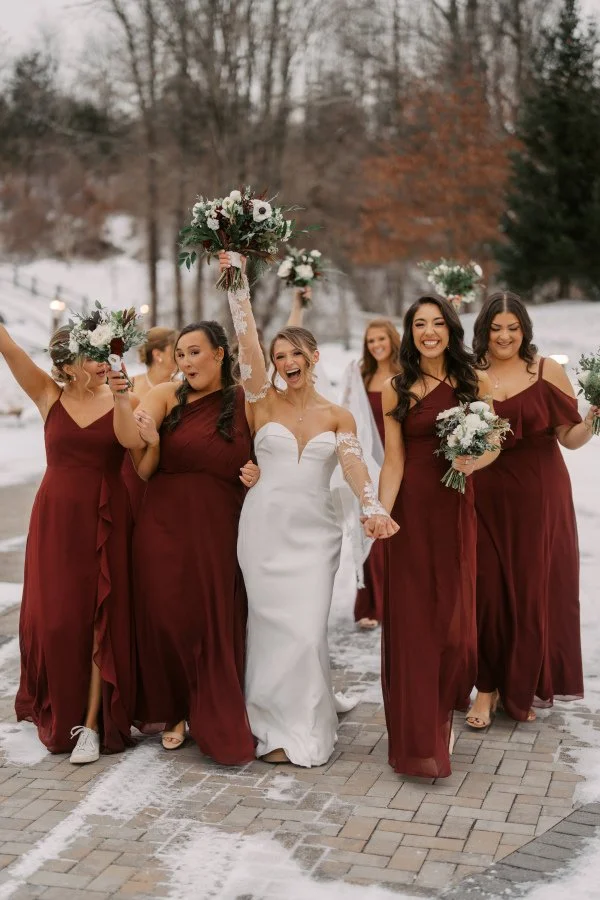 bride and bridesmaids walking winter.jpg