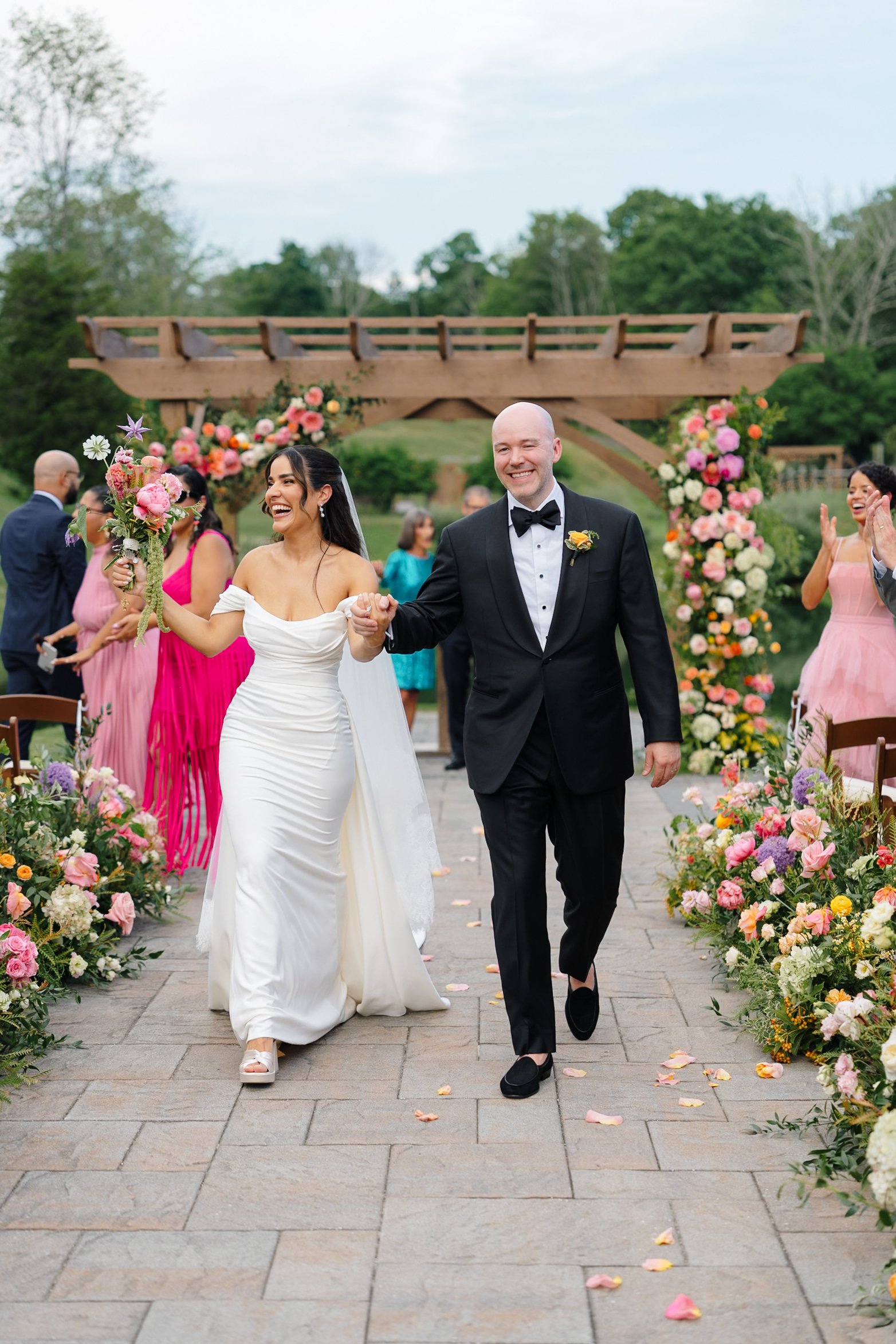 just married, bride & groom, pond ceremony, aisle, florals.jpg