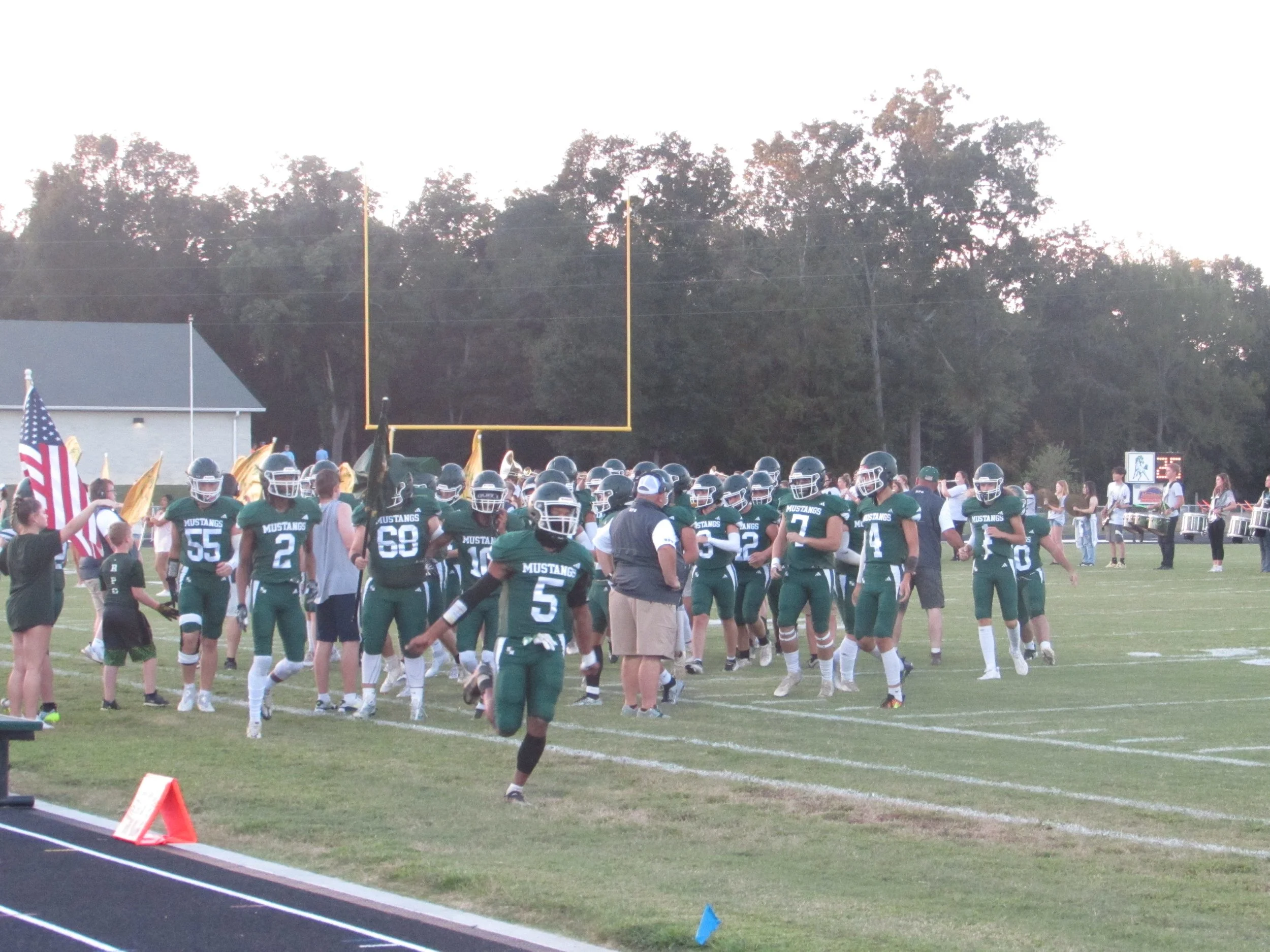 Mustangs win conference opener