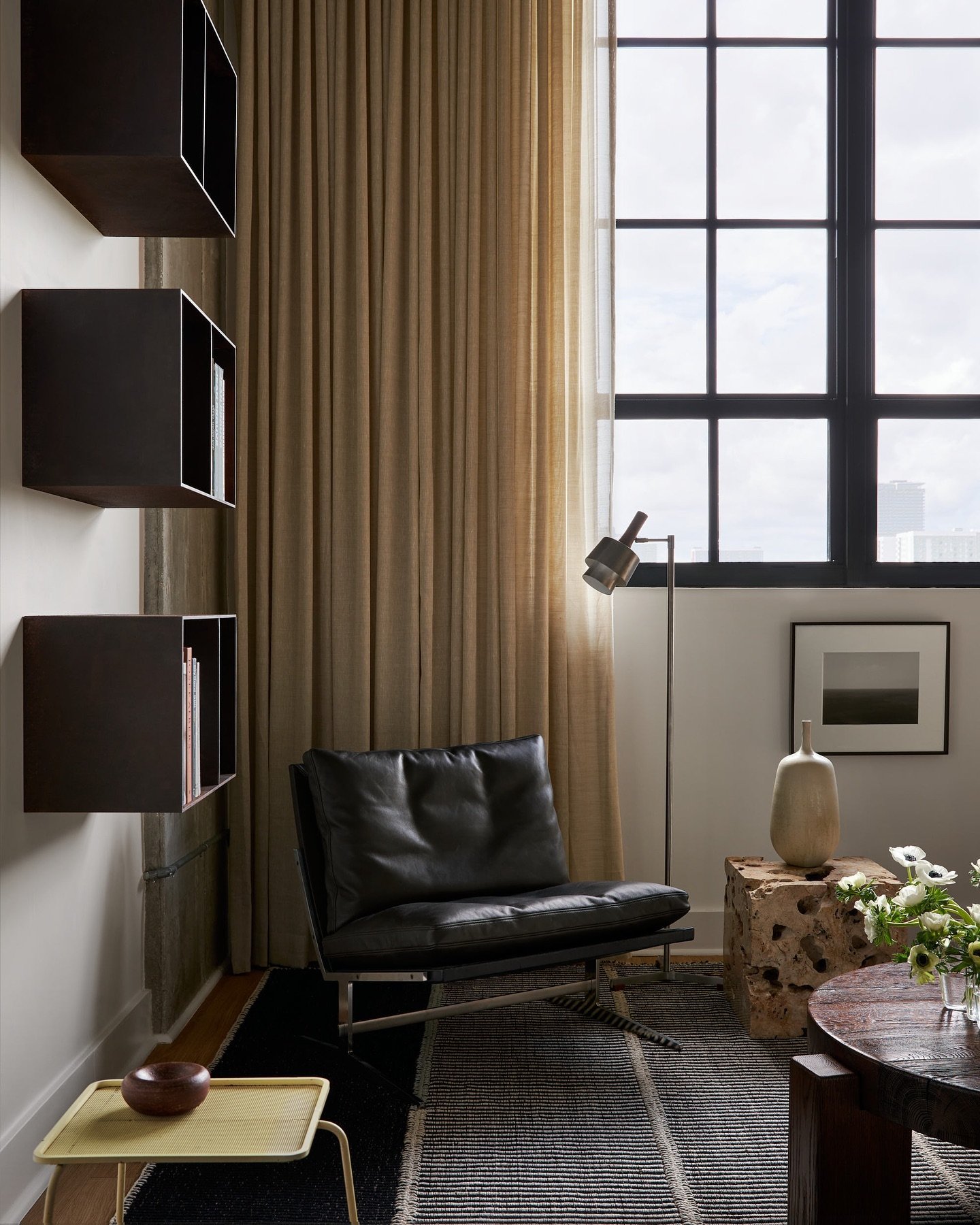 A few Miami outtakes&hellip;

Custom Judd inspired steel bookshelves hang next to a Kastholm &amp; Fabricius lounge chair and Jo Hammerborg floor lamp. A 600lb block of solid travertine functions as a very durable side table. Yellow drink table by Ma