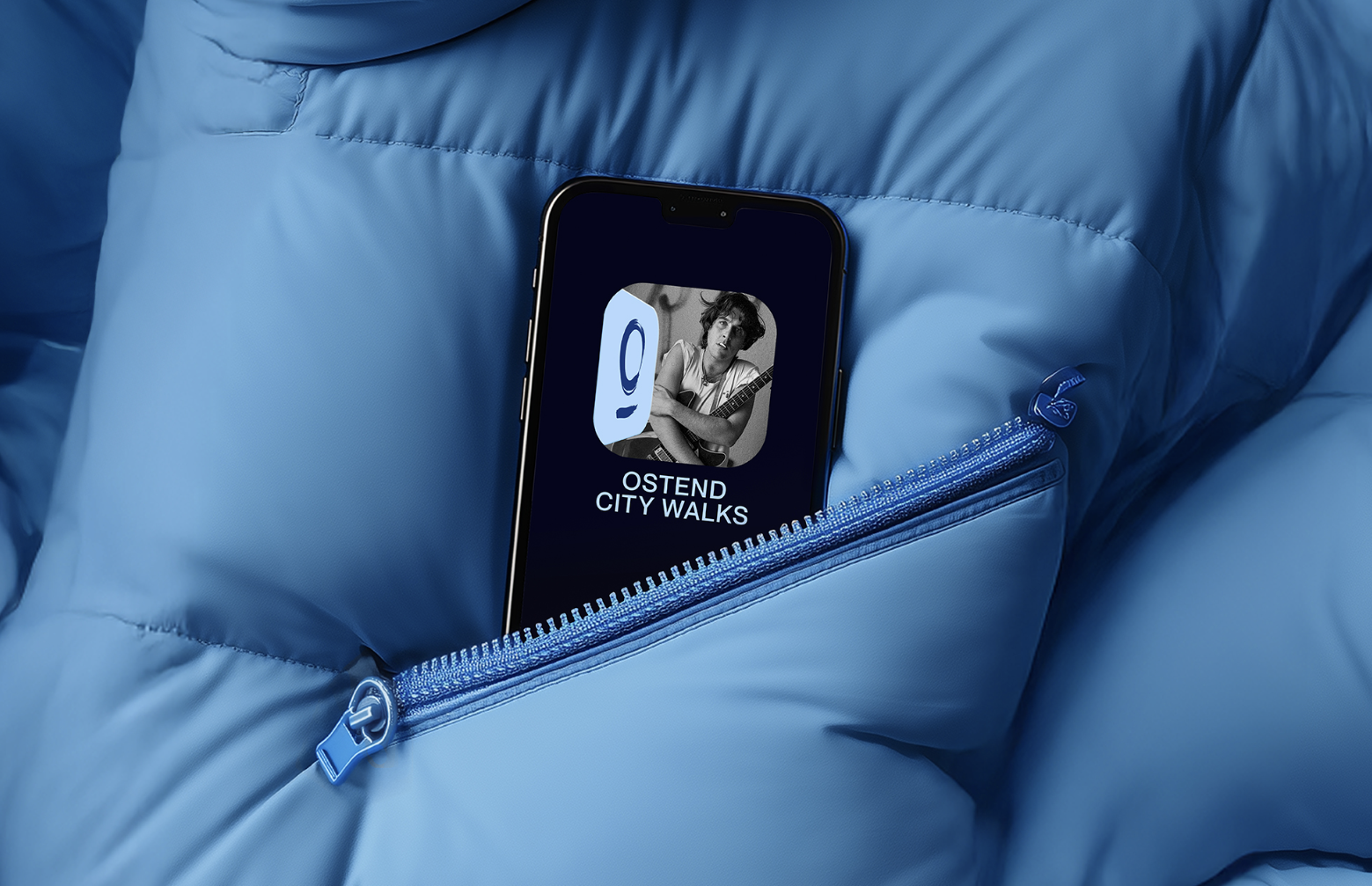 A smartphone with an app icon for Ostend City Walks is placed inside a blue jacket pocket with a zipper.