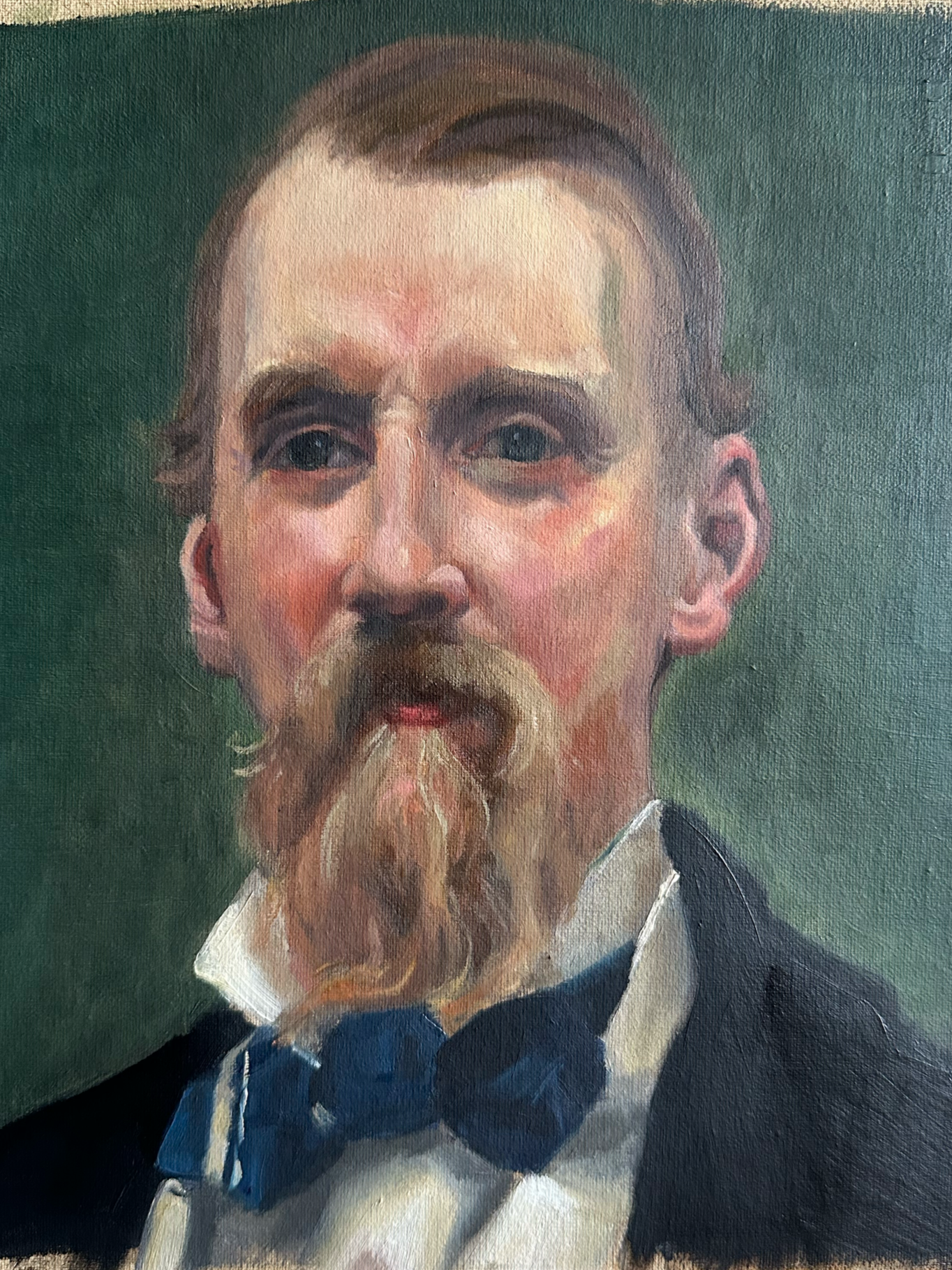 Oil painting of a man with light skin, a beard, mustache, and long hair, wearing a dark suit, white shirt, and black bow tie, with a green background. It is a master copy. 