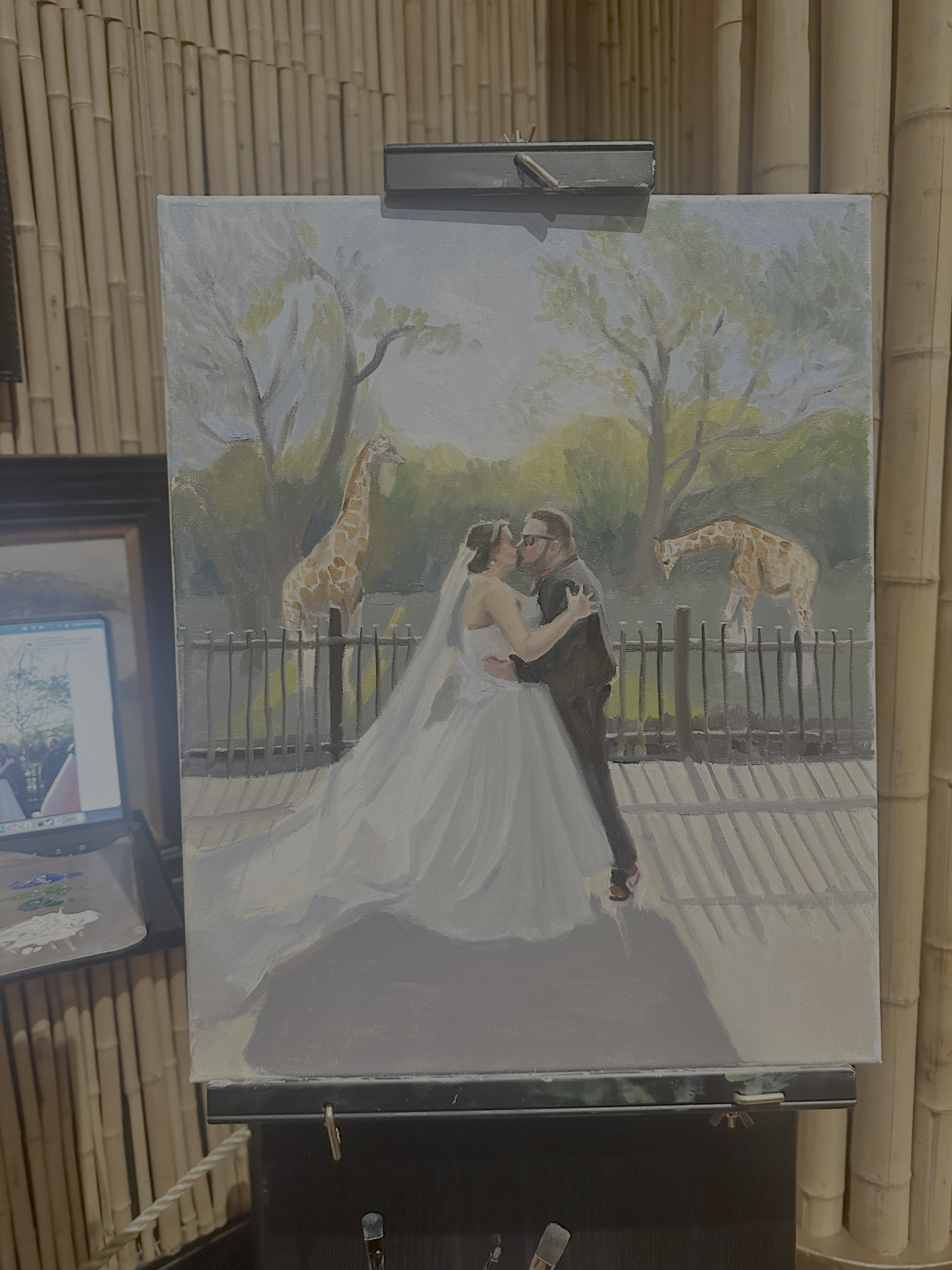 this is a painting of a couple sharing their first kiss at the Fort Worth Zoo at their wedding. There are giraffes in the background, with bright sunlight streaming through the trees. This is an unfinished painting