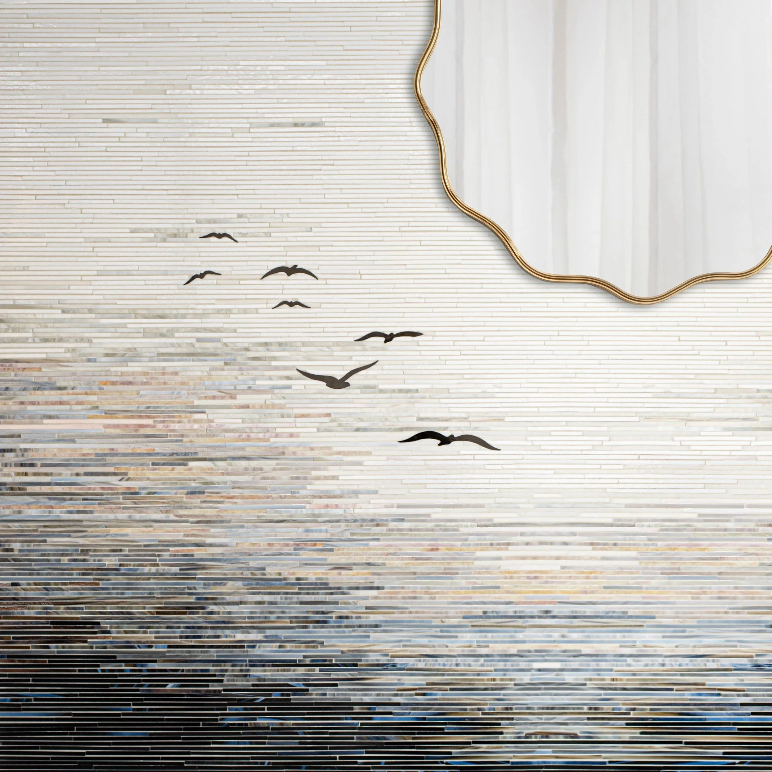 Decorative wall with horizontal tiles, black bird silhouette decals, a large ornate mirror, and a white curtain in the background.