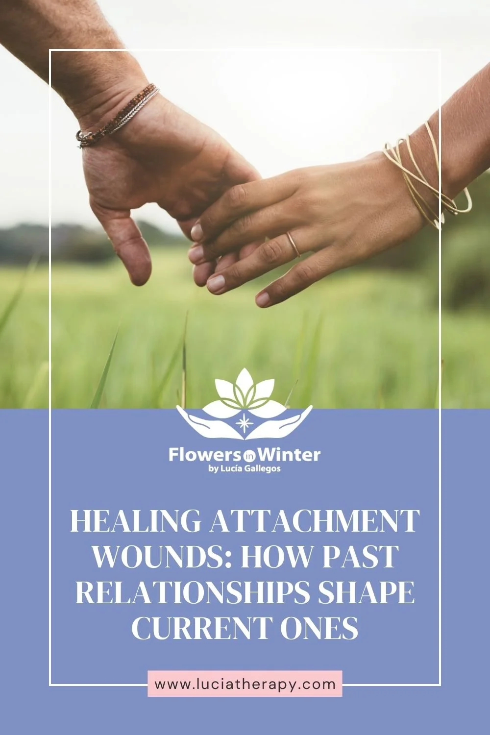 Couple holding hands in a field