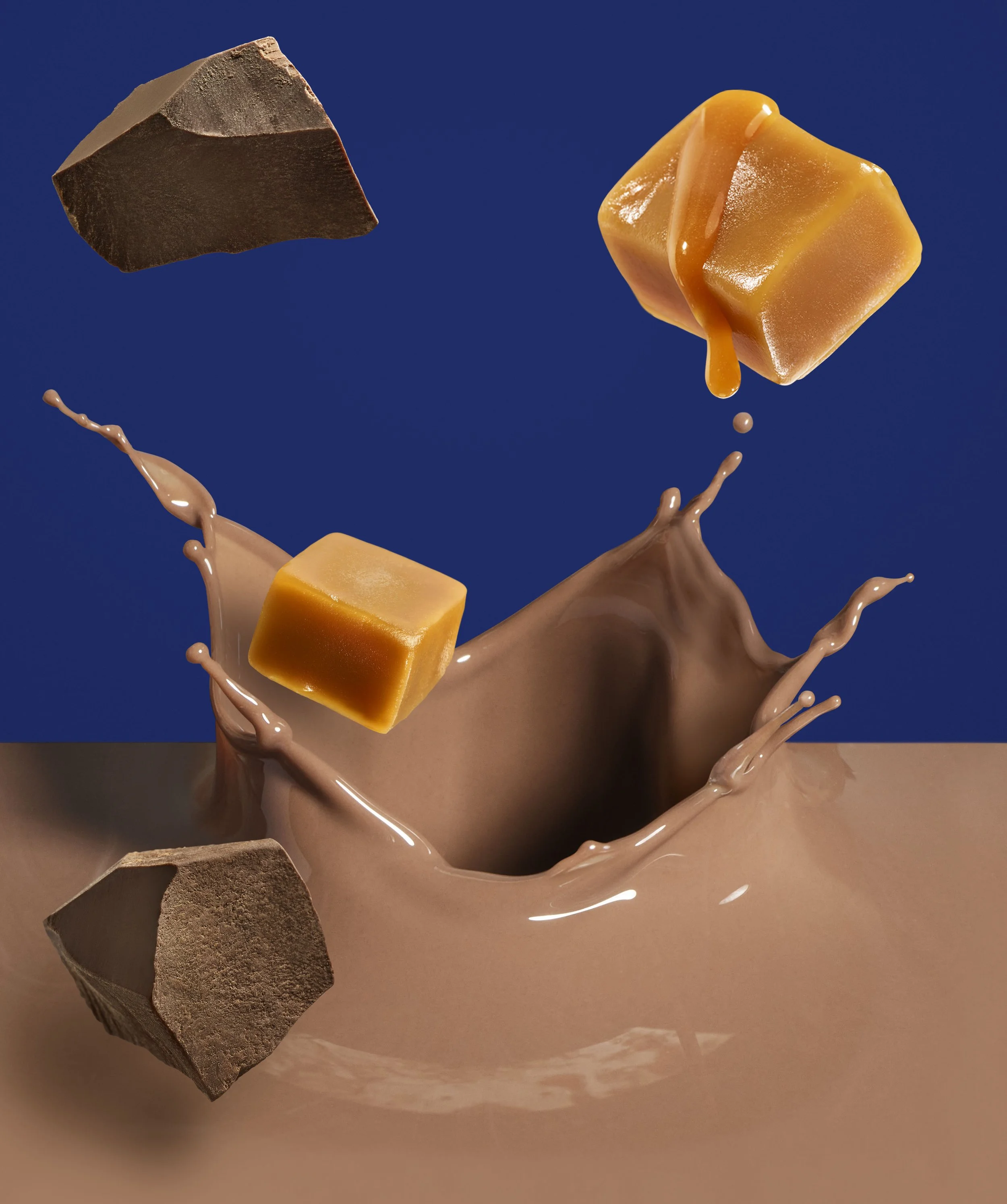 Falling chunks of milk chocolate and caramel with splashes of melted caramel and chocolate around a light brown bowl against a dark blue background.