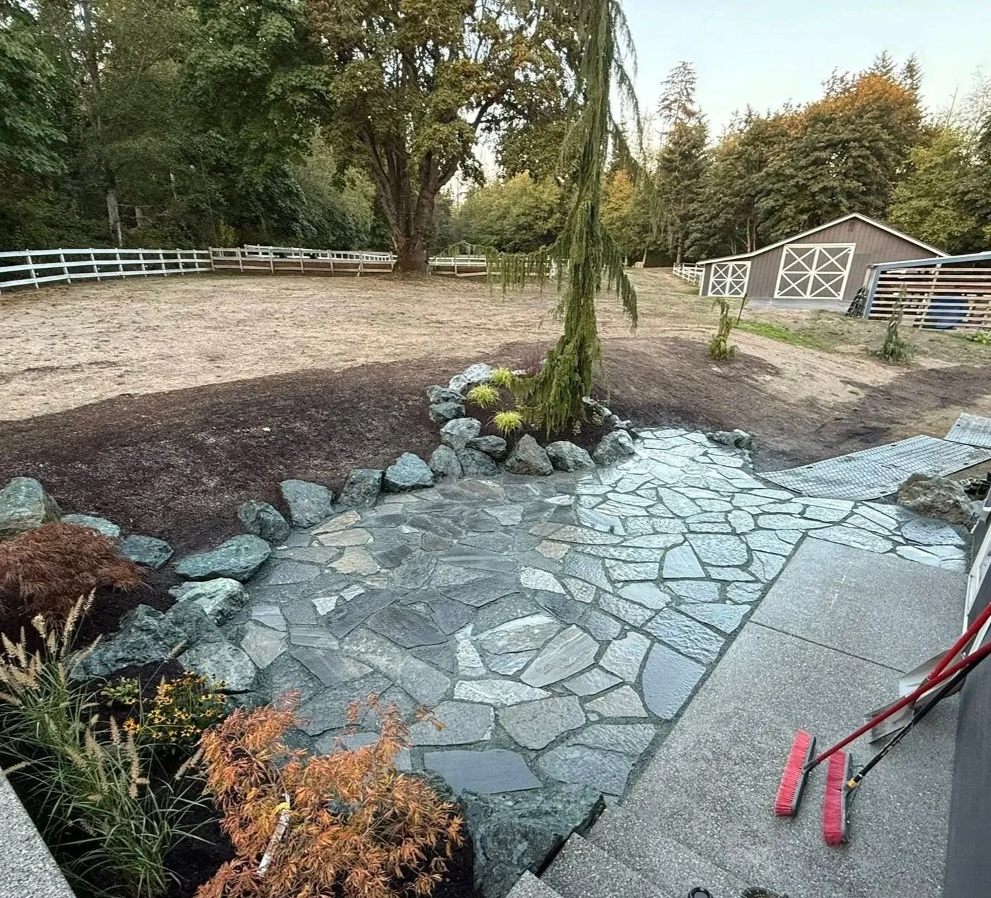 landscaping-with-firepit-area-cowboy-coffee-flagstone-paver-boulders-blue-lakeside