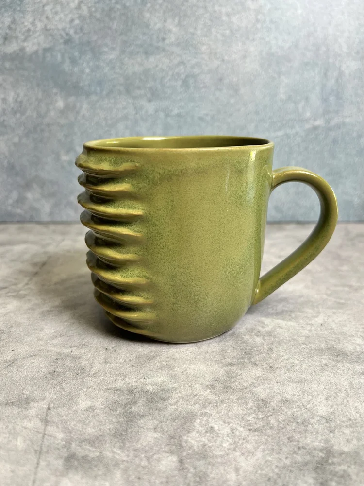 A jade green ridged mug