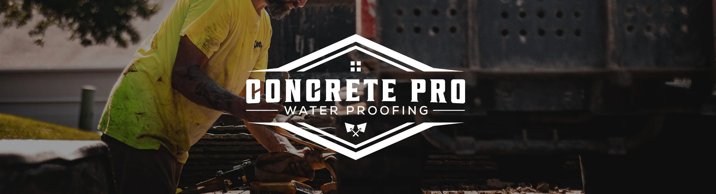 A man wearing a yellow shirt working on a construction project outdoors with a logo overlay for Concrete Pro Waterproofing.