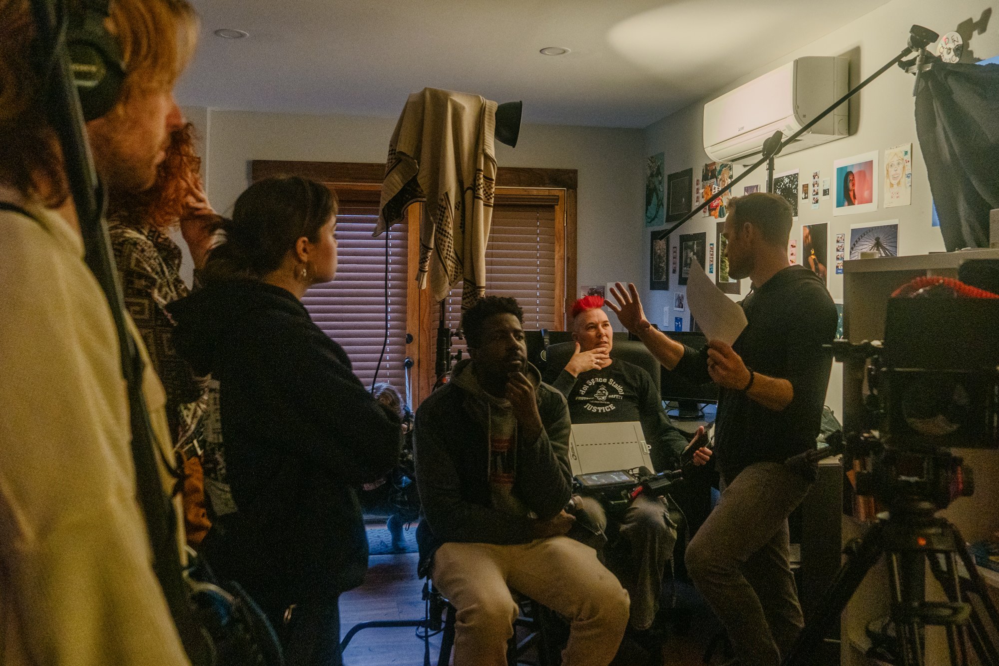 A roomful of crew discuss the upcoming sequence