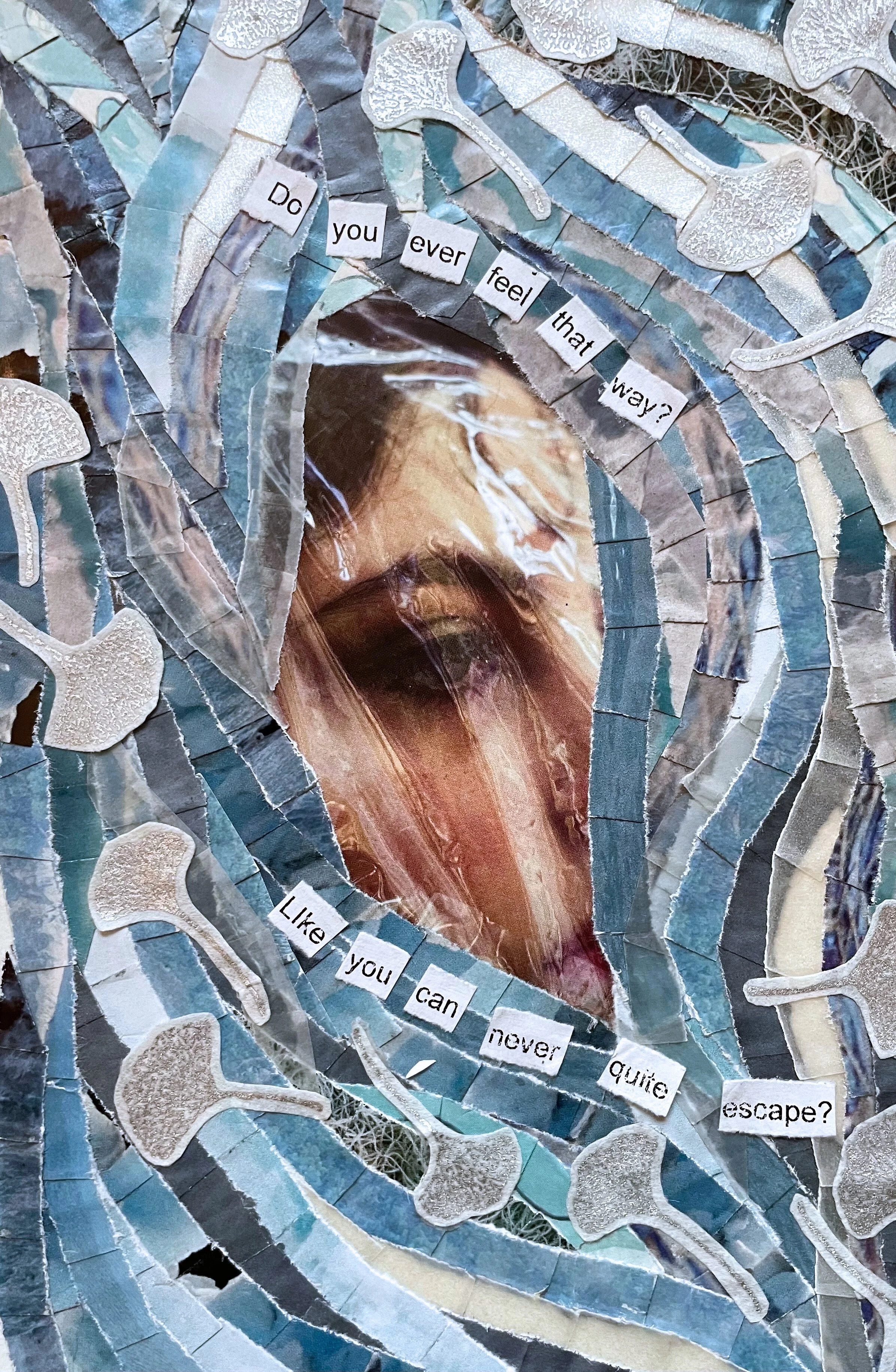 *"Never Quite Escape" (2023). 4.5"x7". A paper collage piece in shades of pale blue and translucent gray. At the center is a photograph of a portion of a woman's face, buried under the criss-crossing, swirling lines of collaged paper. She's covered i