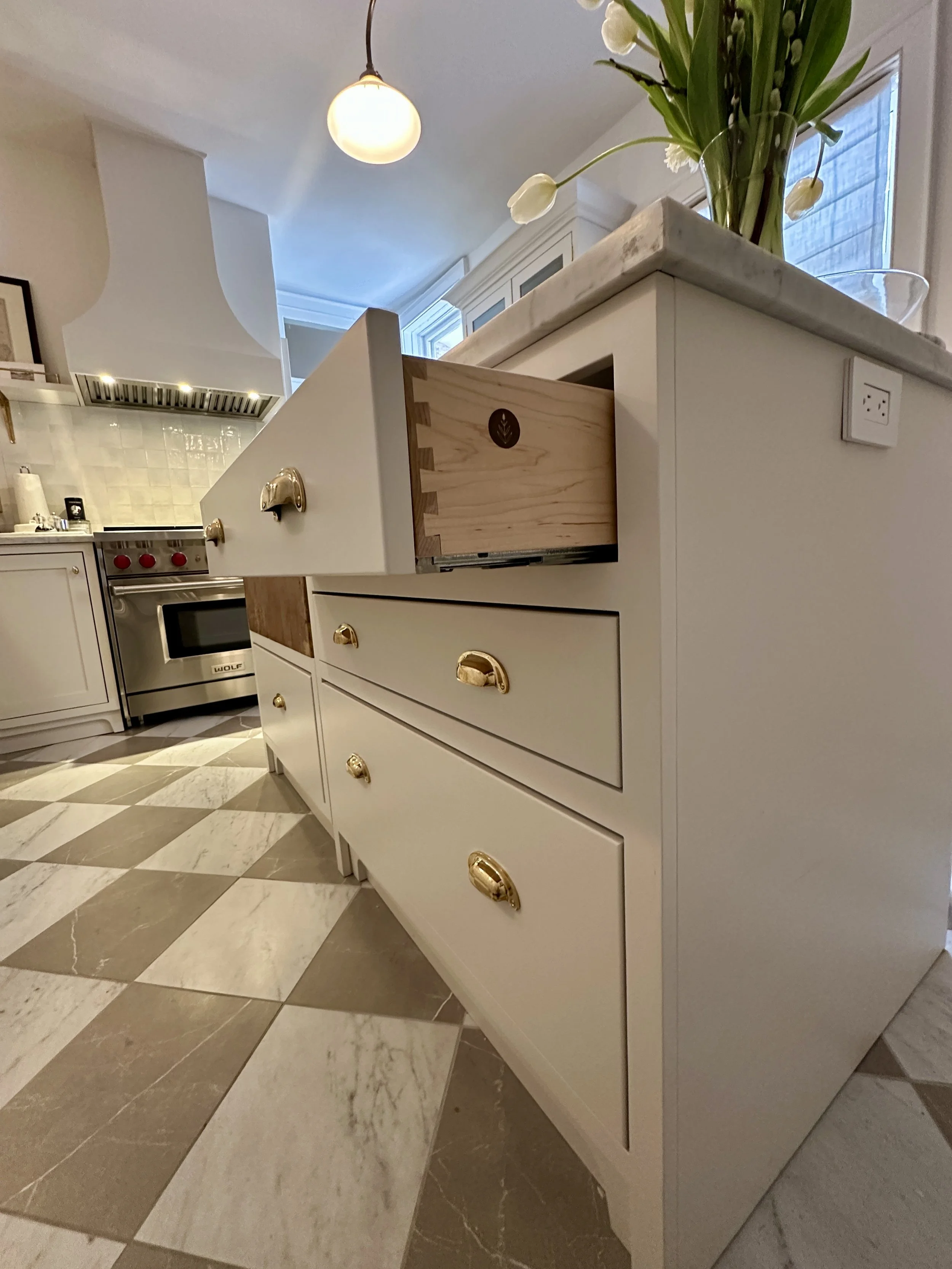 Checker Tile floor and faceframe cabinets with drawers